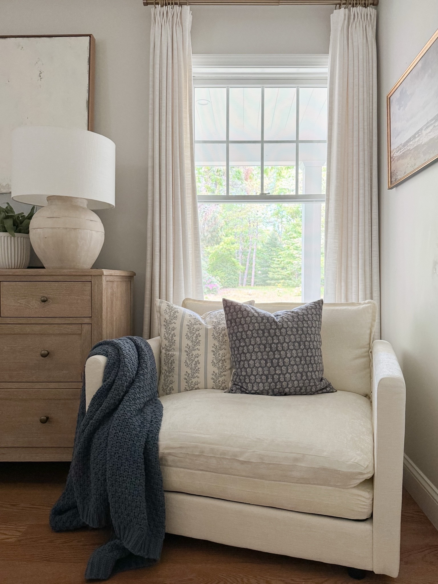 Layered coastal bedroom! Our new bedroom chair is so cozy! This bedroom is all about relaxed layers, soft blues, and classic coastal patterns that make the space feel serene.

#LTKHome