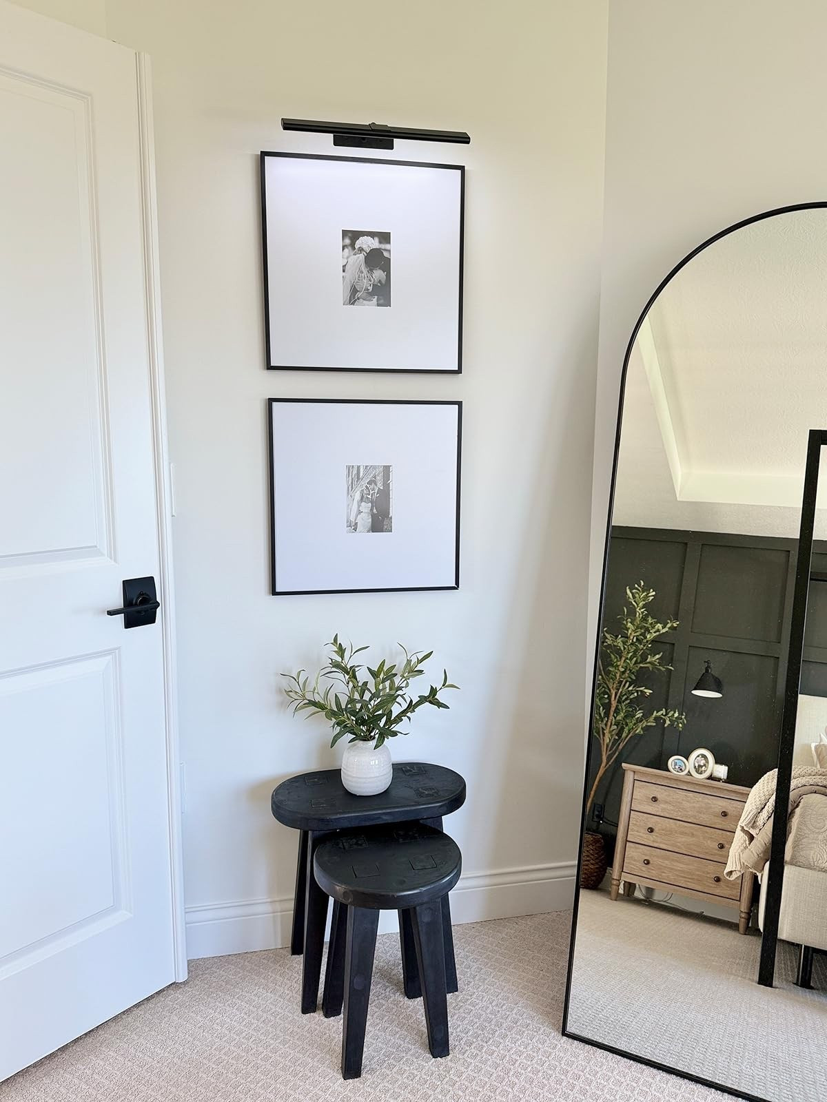 Love this corner of our bedroom. The picture light is the perfect touch to these gallery frames and arch floor mirror! 

#LTKHome #LTKSaleAlert