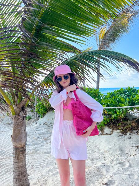 A striped button down set paired with a bikini, tote bag, sandals, bucket hat, and sunglasses makes a great resort wear or vacation outfit. 
.
.
.
.
.
#LTKSeasonal #LTKSale #LTKFind #LTKU #LTKbeauty #LTKitbag #LTKsalealert #LTKshoecrush #LTKstyletip #LTKswim #LTKtravel #LTKunder50 #LTKunder100 

Vacation outfits | beach vacation | beach outfits | beach bag | swimsuits | swimwear | bikini set | pink bikini | beach hat | button down shirt | striped shirt | matching sets | resort wear 2023 | resort outfits | short set | beach sandals | sandals 2023 | summer sandals | outfit ideas | outfit inspo | summer outfits | 