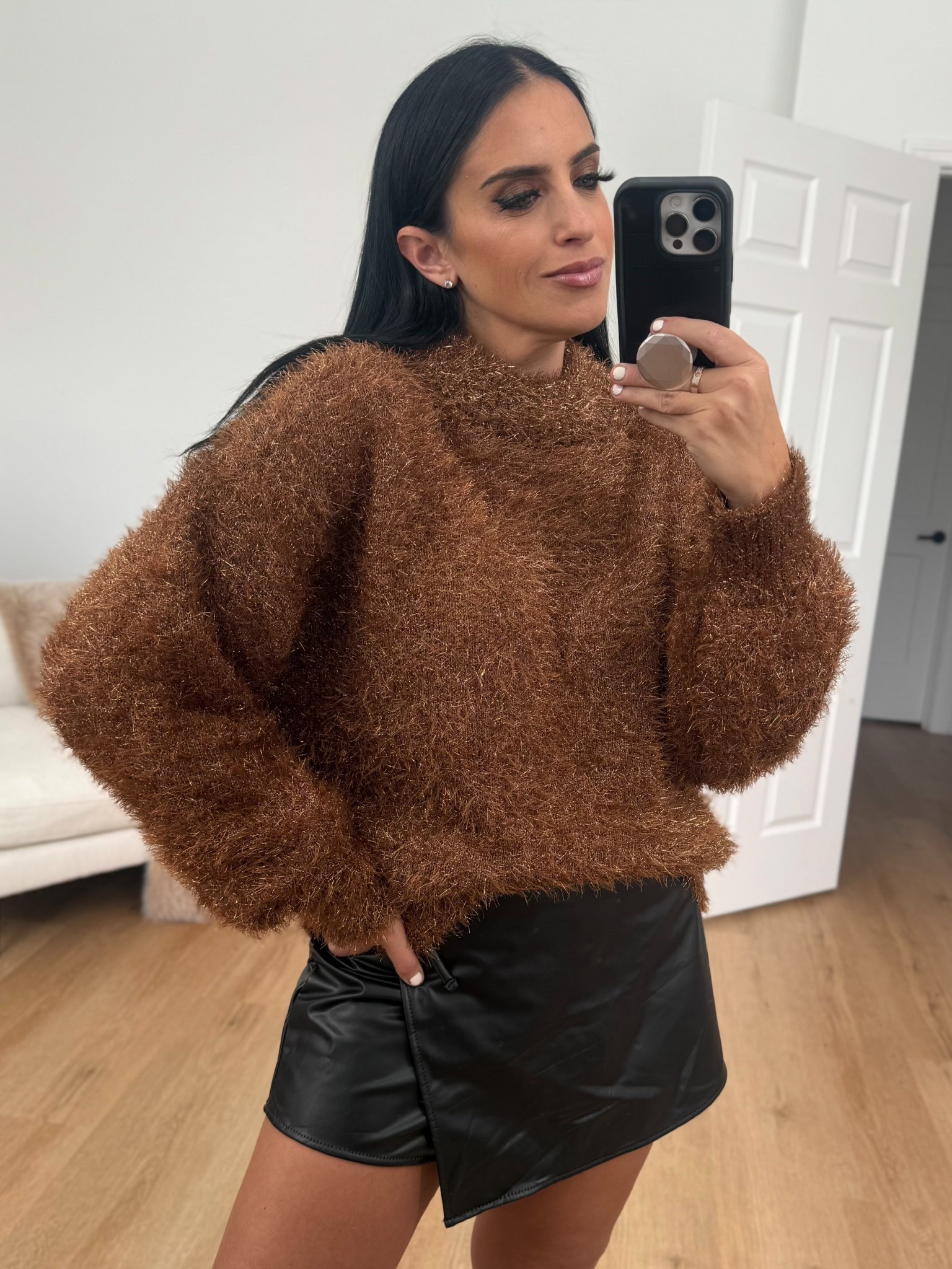 Madden NYC Women's Faux Leather Wrap Skort wearing size medium. Scoop Women's Tinsel Knit Tunic Sweater with Long Sleeves wearing size small. 
