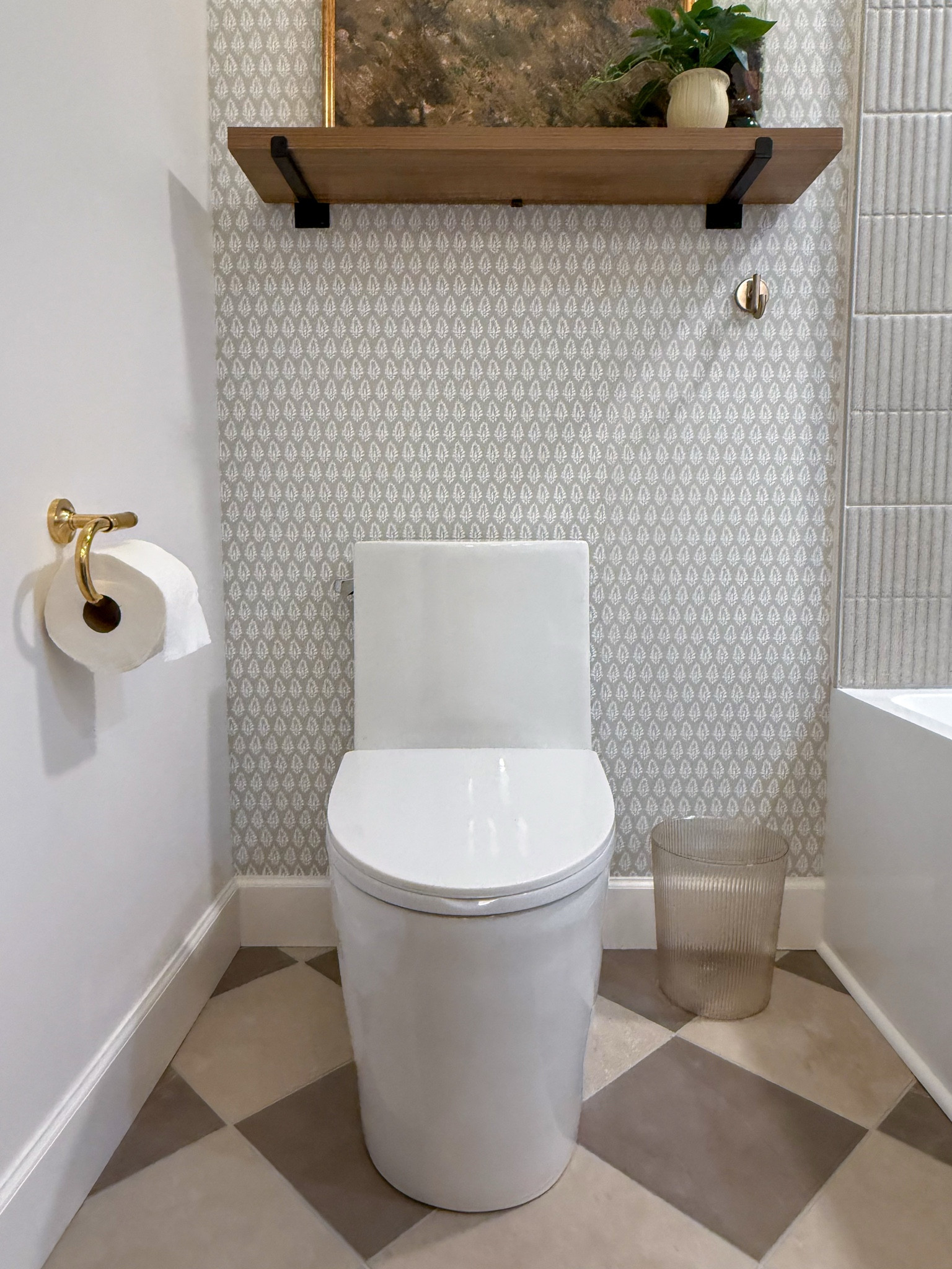 A reminder that no part of a bathroom has to be boring. Adding wallpaper, art, and timeless Rejuvenation hardware makes even this little corner feel thoughtful and styled. 

 #LTKHome