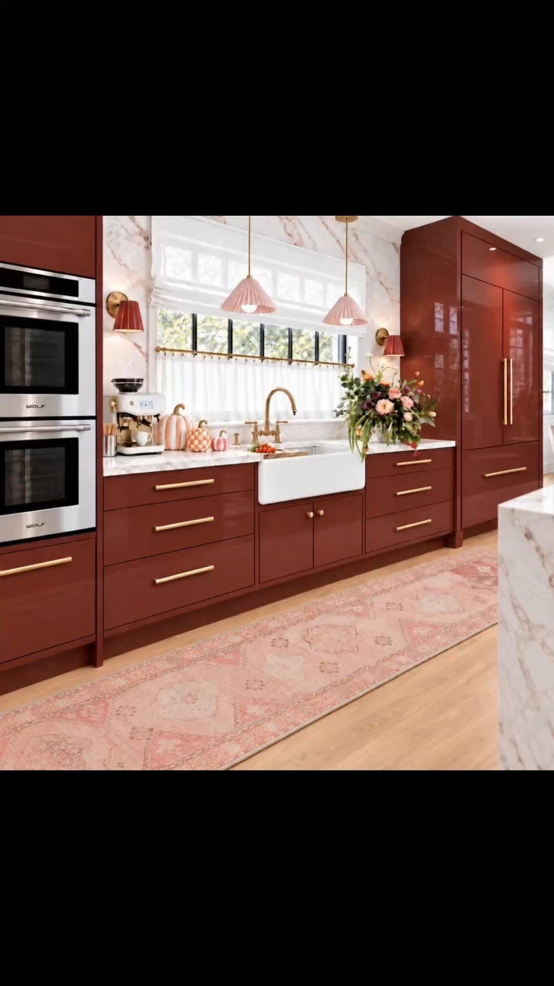 Bring a little more color, personality, and holiday cheer into your kitchen! ✨💕🥂

Who says a kitchen has to be all neutrals? I love embracing rich, joyful colors that make everyday living feel more beautiful, especially during the holiday season!

This chic combination of glossy burgundy cabinetry, soft blush pink, and crisp white marble feels playful yet sophisticated. The delicate pleated pendants and elegant fabric-shaded sconces bring a couture-inspired touch, gradually illuminating the kitchen with a soft, welcoming glow.

Beautiful brass details, a classic farmhouse sink, and a vintage-inspired pink runner add warmth and timeless character. Fresh flowers, charming pumpkins, and a cozy espresso station make the space feel cheerful, inviting, and ready for everything from morning coffee to festive holiday gatherings. 🎃☕️

It’s a kitchen with personality, where bold color meets modern classic elegance and every gathering feels a little more special.

Check out my handpicked kitchen favorites on my LTK!

#HolidayKitchen #HolidayEntertaining #ColorfulKitchen #KitchenDesign #KitchenInspiration #KitchenRefresh #BurgundyKitchen #PinkKitchen #ModernChic #ModernClassic #CoutureInspired #KitchenLighting #LayeredLighting #PleatedPendant #PendantLighting #WallSconce #MarbleBacksplash #MarbleCountertops #FarmhouseSink #BridgeFaucet #BrassHardware #KitchenRunner #VintageInspiredRug #RomanShade #CafeCurtains #CoffeeStation #EspressoMachine #FlowerArrangement #PumpkinDecor #FallKitchenDecor #GatheringSeason #InteriorDesign #HomeDecor #LTKHome #LTKStyleTip #LTKSeasonal