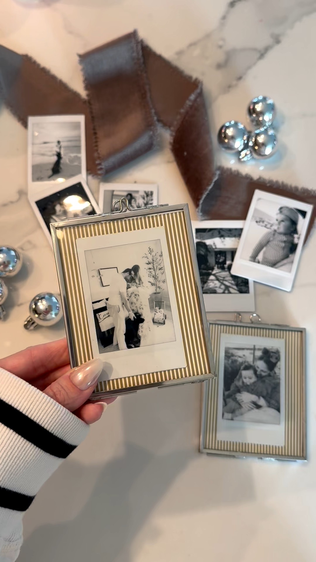 The cutest ornament diy with mini Polaroids 🤍✨🤎 just ordered more frames, they’re currently on sale! I just added some wrapping paper as the background and a black and white Polaroid. 

#LTKHoliday #LTKmomlife #LTKHome