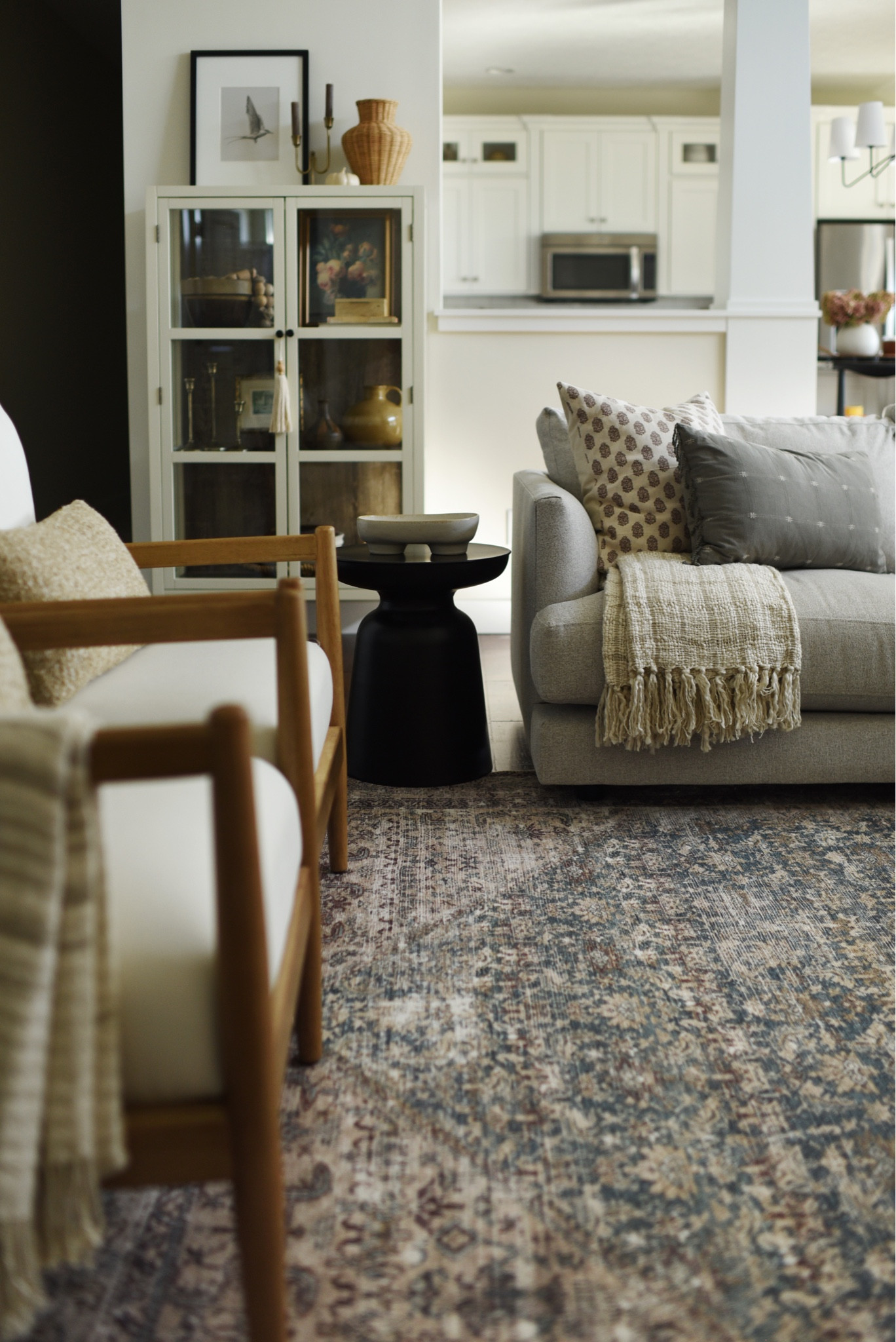 Living room, Loloi rug, Amber Lewis, West Elm sofa, glass cabinet, side chairs, pillows, side table, Juniper Prints

#LTKhome #LTKfamily #LTKSeasonal