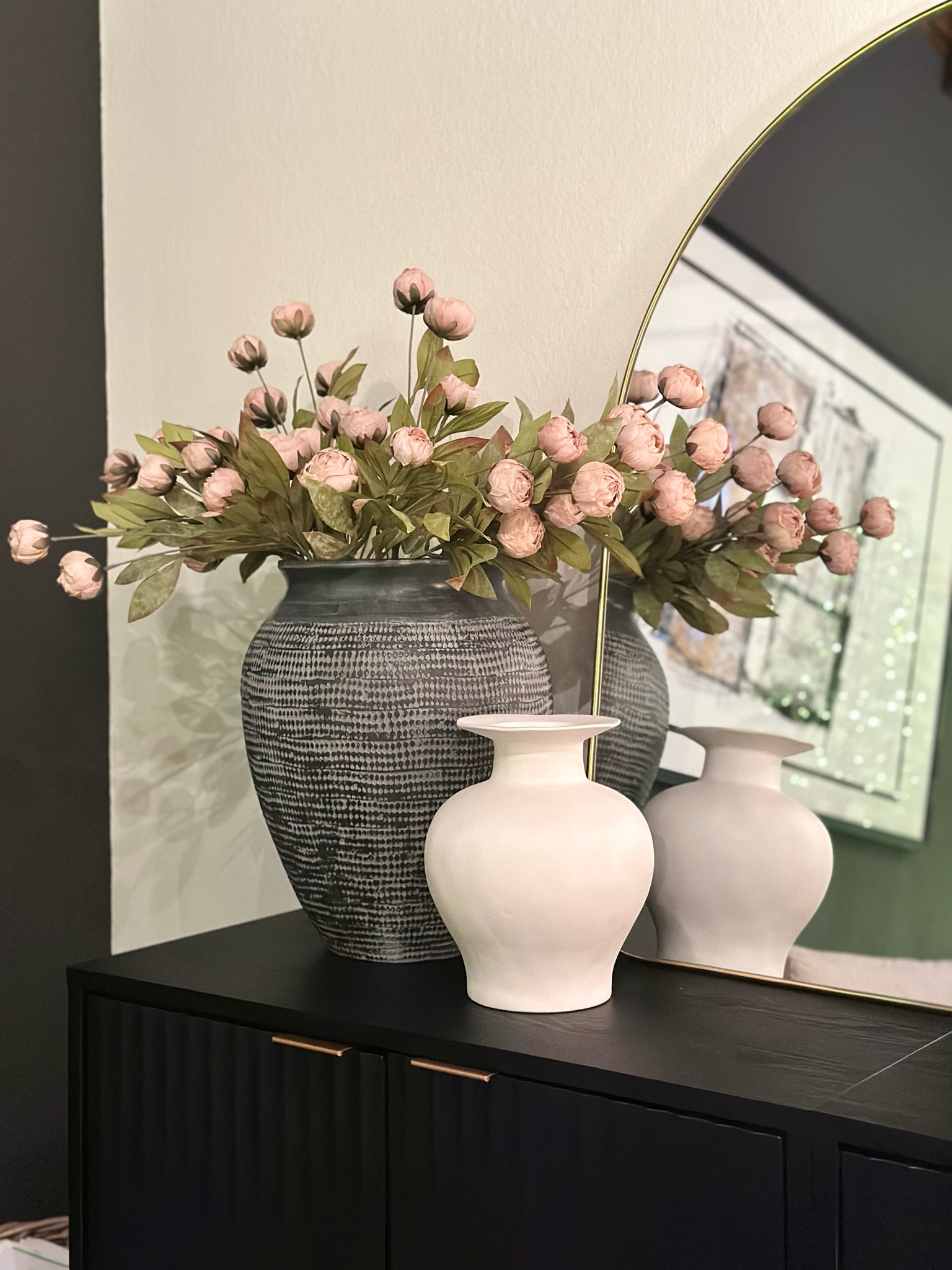 There’s still a Christmas tree up in here but couldn’t resist playing g around with the peonies! Hopefully they will come back in stock soon. 

I might switch the vases out but do like the height for this wall.

#LTKHome