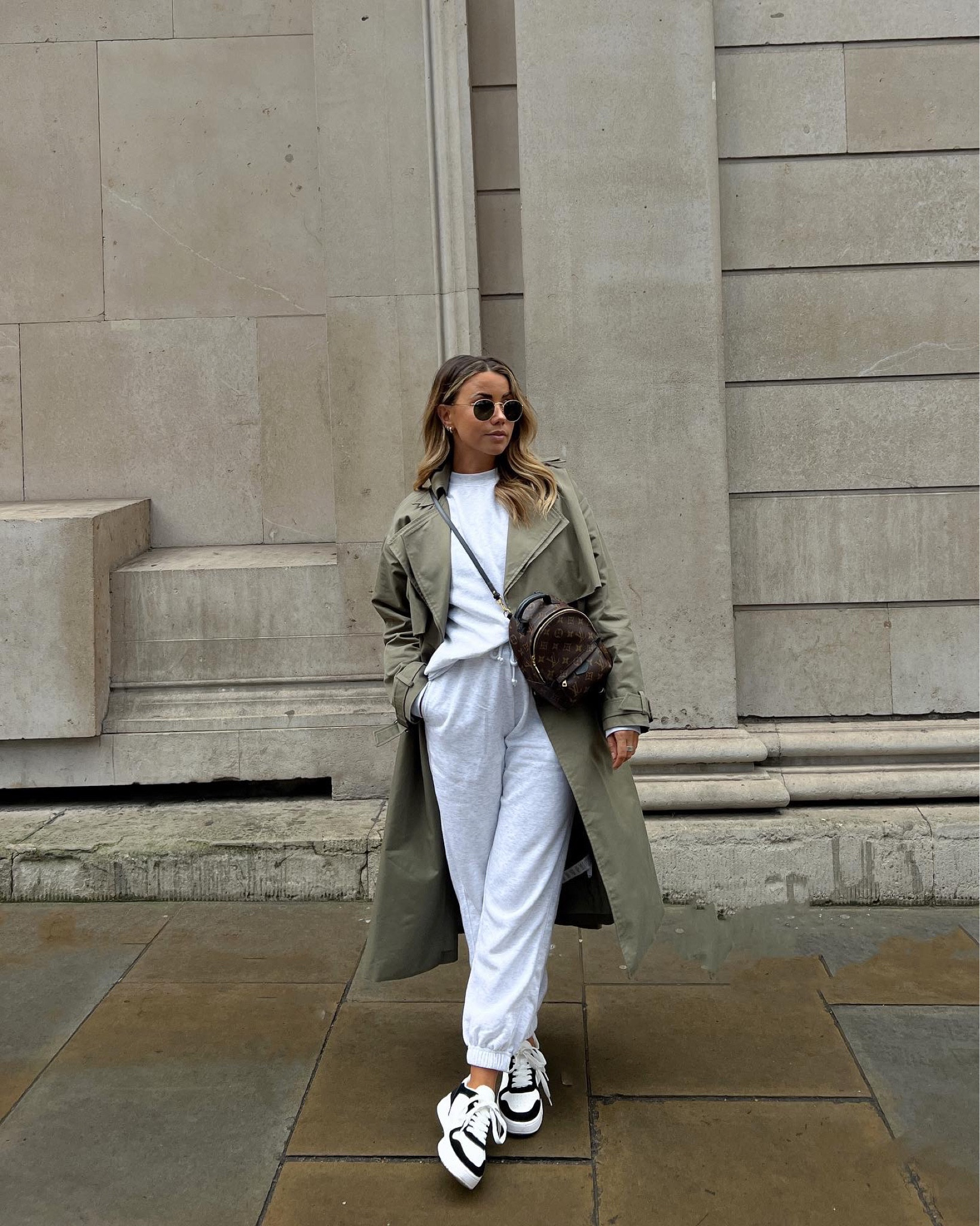 Comfort > everything ☁️ it’s such a grey, gloomy day in the city so it’s the perfect opportunity for dressing cosyyyy. I think I own this @primark tracksuit in every possible colourway because it’s so comfy (and under £20) 🌿 
.
< shop this outfit via LTK in my bio, stories and march highlight >
.
Trench - Nasty Gal *
Sweatshirt, Sweatpants and Trainers - Primark
Bag - Louis Vuitton Mini Palm Springs 
.
.
.
Minimal outfit. Comfy outfit. Casual styles. Easy outfit inspo. Comfortable outfits. Basic fashion. Capsule wardrobe. Khaki trench coat styled with grey tracksuit and Nike dunk dupes. Effortless style. Minimal fashion. Spring inspiration. Spring outfit. Spring style. Pinterest fashion. London style. What to wear in London in march.

#LTKunder50 #LTKstyletip #LTKeurope