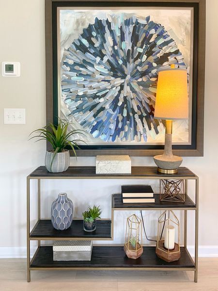 Entryway console table inspo! Large abstract art print paired with an open shelf layered with decor items. 

#LTKstyletip #LTKhome