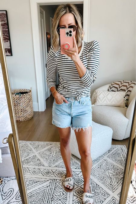 Branch vacation outfit idea. I always get asked about this top anytime I wear it in my reels on Instagram! It has the cutest little puff sleeves (not too big because I can go linebacker quickly). I’m wearing small.

And of COURSE, I had to bring my favorite denim cut offs of all time. If you’re in the market for cut offs that you’ll wear the hell out of for years to come, this is the pair. They’re high rise, but not too crazy, and the longer length make them #momlife approved. I’m wearing my normal size.

#LTKSeasonal #LTKtravel #LTKstyletip