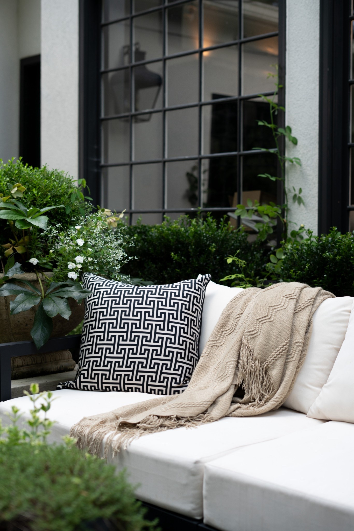 There’s just something magical about an outdoor space that feels like an extension of your home—and this patio is giving all the right vibes! I styled it with classic black and white pieces, layered in cozy textures, and brought it to life with lush greenery and topiary trees. That fountain? It adds the dreamiest sound and makes the whole space feel like a European courtyard. I even tucked in a few veggies and herbs—because why not mix gorgeous and functional? Whether you're hosting friends or sipping coffee solo, this setup is equal parts chic and comfortable.


#LTKStyleTip #LTKSummerEdit #LTKHome