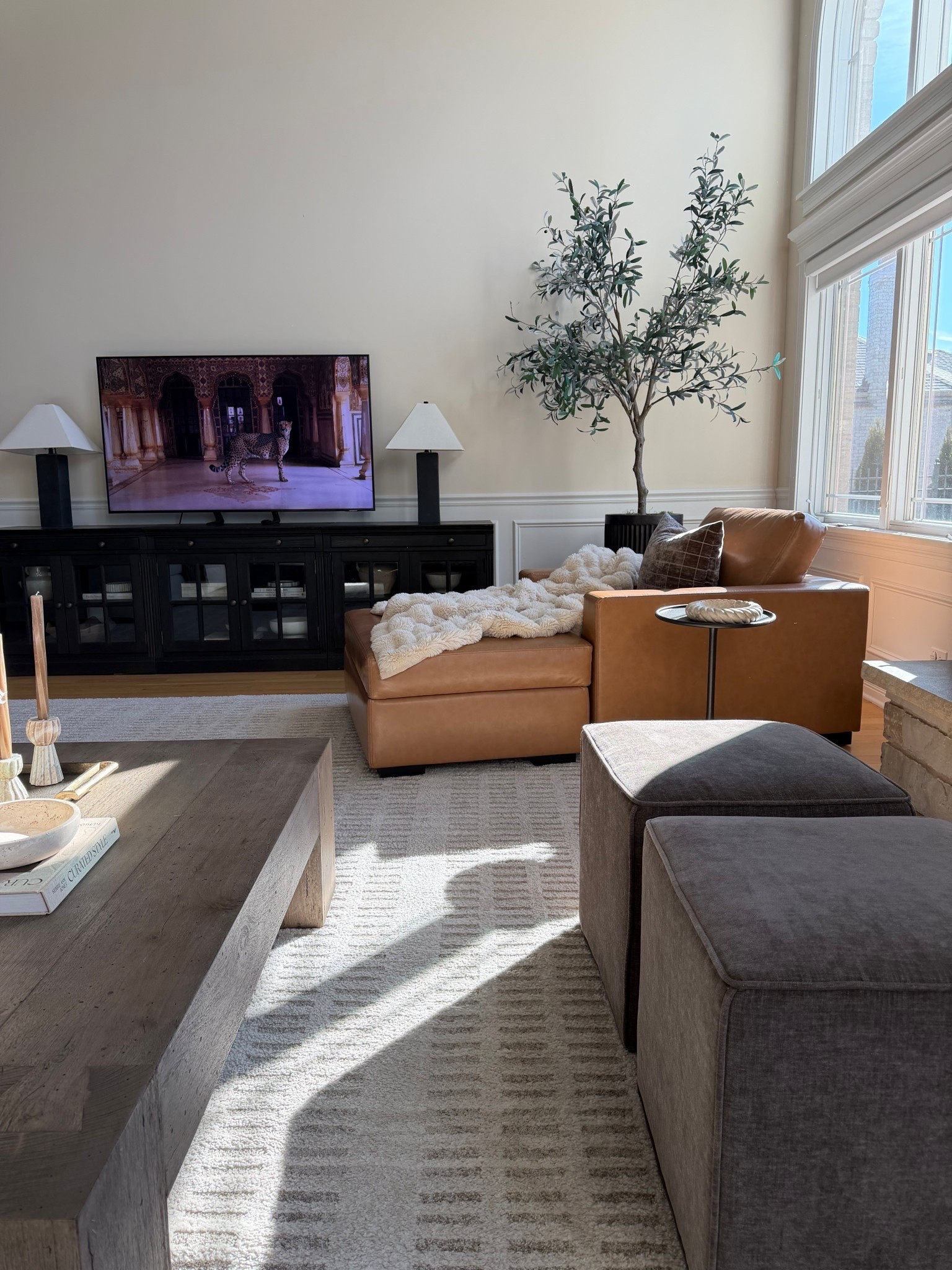 One of my favorite corners in our home. ☀️🤍

The afternoon light, warm neutrals, layered textures, and the pieces we use every day make this space feel so calm. I’ve linked everything I could—from the coffee table and rug to the lamps, olive tree, pillows, and decor.

#LTKHome