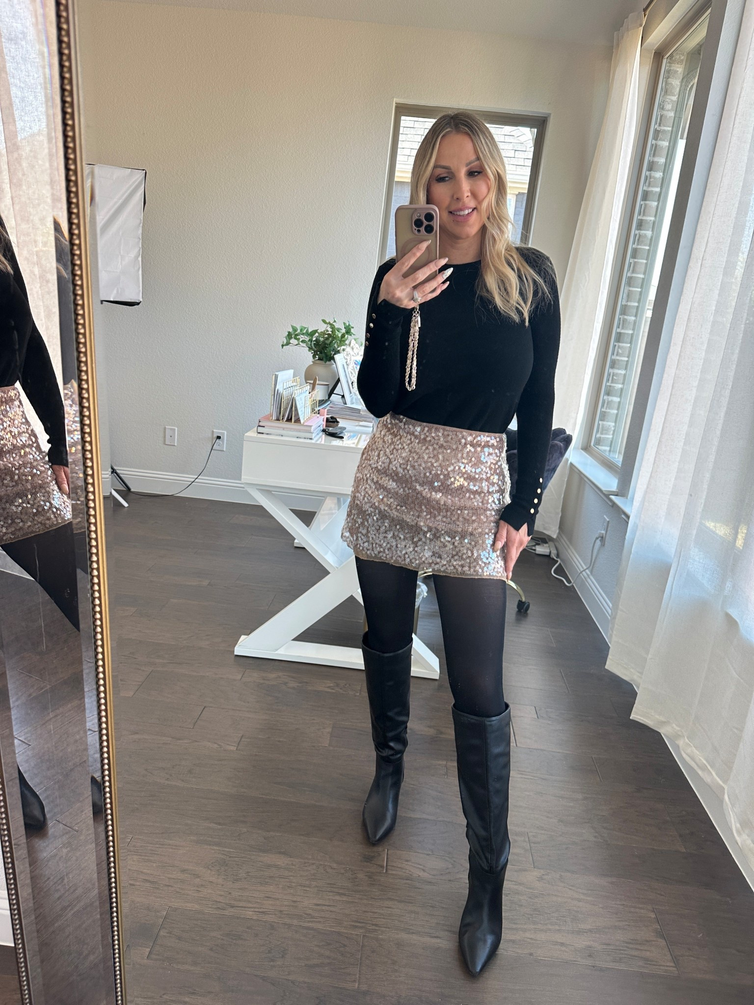 New Year’s Eve outfit details ✨
This Zara sequin mini skirt is such a good statement piece for holiday parties or NYE — sparkly, flattering, and easy to dress up or down. I styled it with a classic black top, sheer tights, and knee-high boots for a polished high-low party look that works beautifully for women over 40.

Shop this Zara New Year’s Eve outfit and all my affordable party finds linked here 🤍