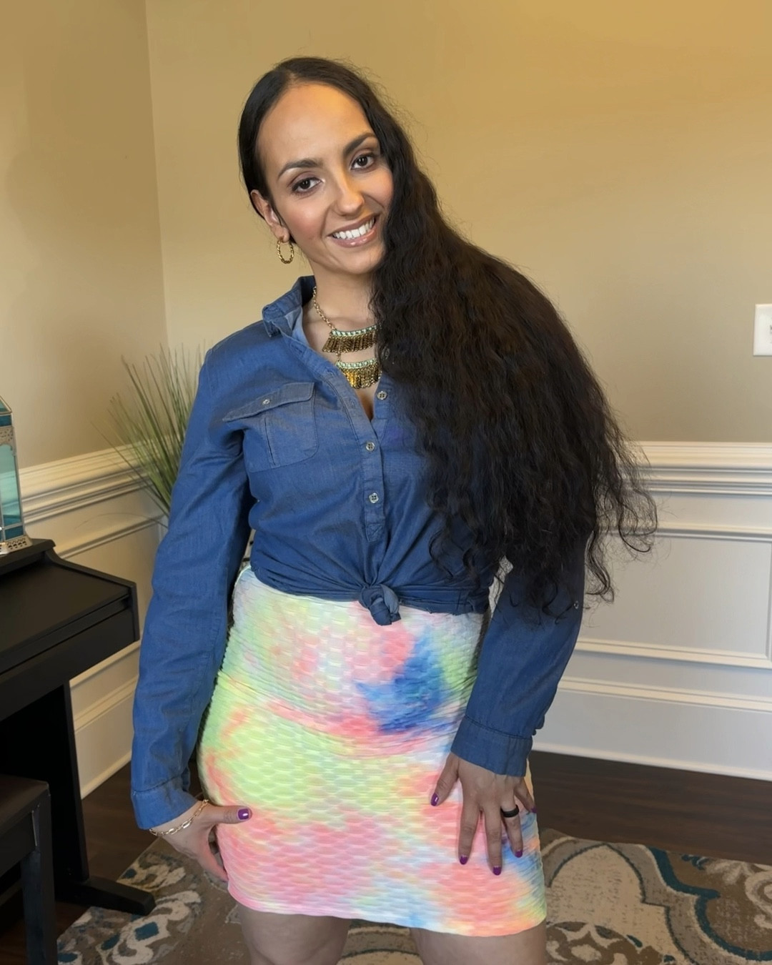 Denim and Tie Dye: A Perfect Pairing with Orange Nike Jordan 1s!

In this photo, the model is wearing a denim chambray shirt, which is partially unbuttoned and tucked into a colorful tie dye skirt. The skirt features a bold and vibrant pattern, with a mix of blues, pinks, and yellows. Completing the ensemble are a pair of sleek and sporty orange Nike Jordan 1s, which add a pop of color and edge to the outfit. The overall look is casual and playful, perfect for a day out with friends.

#LTKSeasonal #LTKfit #LTKshoecrush