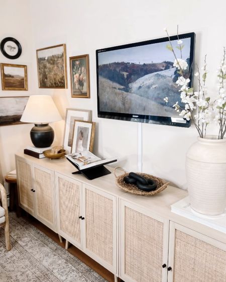 Console table styling, accent table, accent cabinet, wall art, tv console, entertainment center, table lamp, vase, spring stem, table books 

#LTKhome #LTKFind #LTKsalealert