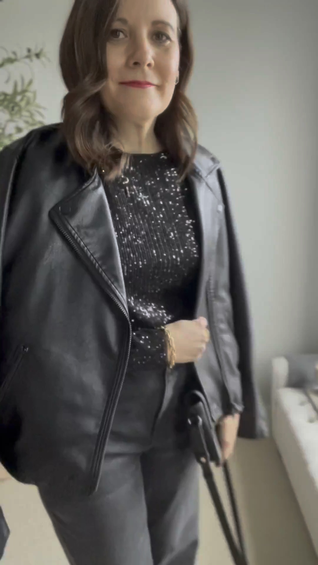 I love a boatneck top and have received several compliments on this black sequined one on Instagram. It’s so flattering! Wear it with black velvet pants or with black jeans, a leather jacket, and dressy black boots for a night out or even New Year’s Eve. The top runs small. I am in a large with a 36B bust. I’m wearing it with LOFT wide leg black jeans in my true size. They fit relaxed and gap a little at the waist. I could probably size down. They do run long, and since the hem is raw, I’m planning to trim off about an inch of length. 
 

 

#LTKCyberWeek #LTKHoliday #LTKOver40