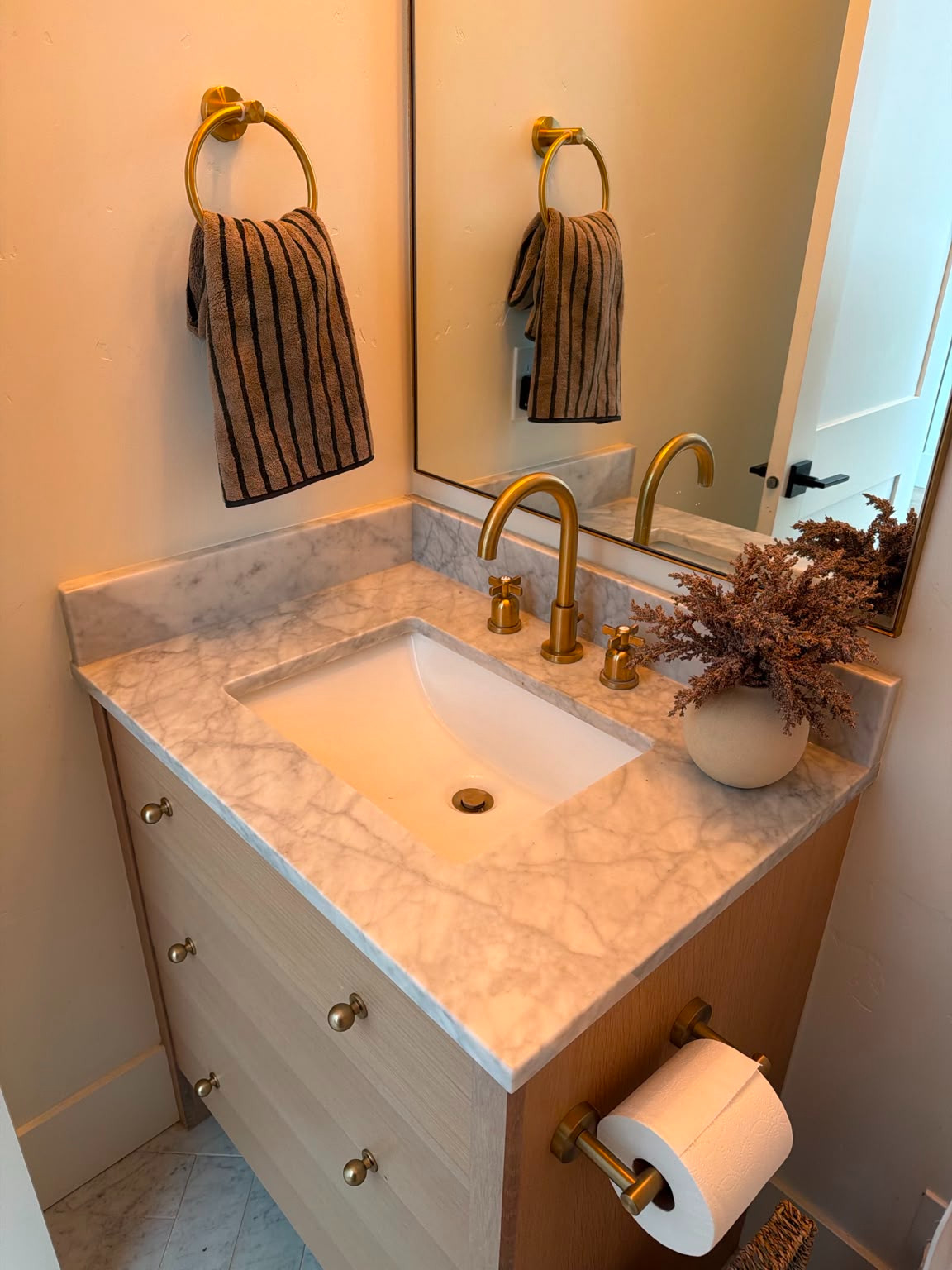 I linked all the details from this powder bathroom, including the marble vanity top, brass faucet, hardware, and striped hand towel.

I love how the warm brass finishes and natural wood tones make this small space feel elevated, timeless, and custom without feeling overdone. Shop everything linked below.
@Lowers

#LTKU #LTKSaleAlert #LTKHome