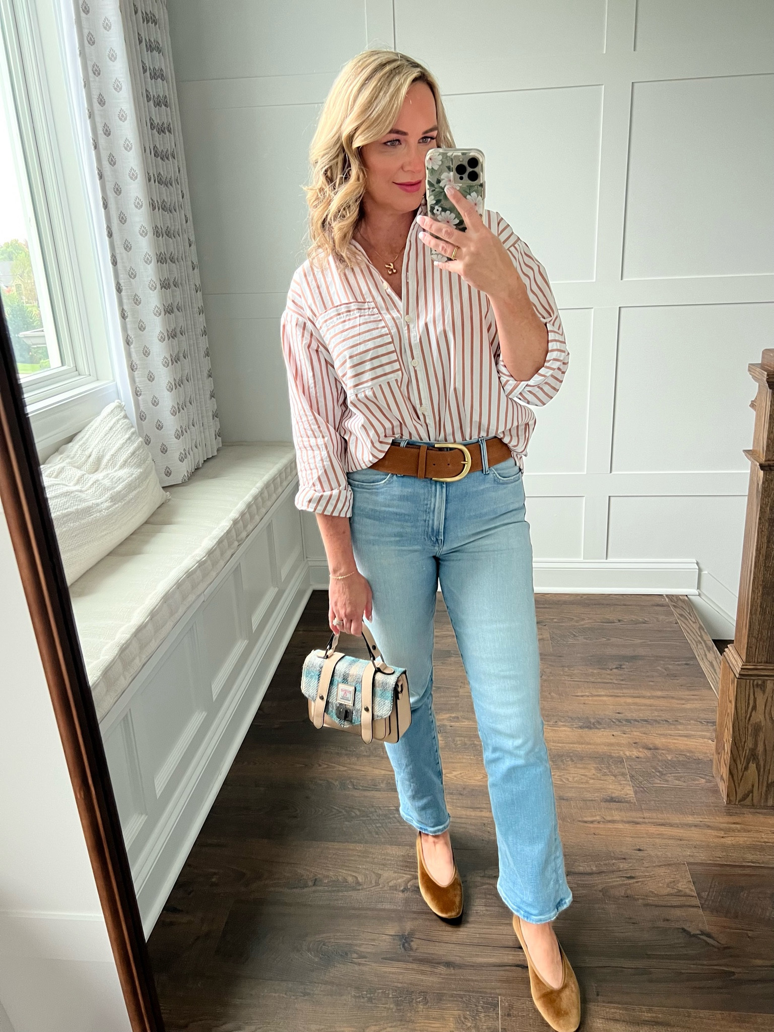 This stripe shirt is classic and on sale from Loft! Wearing size small for reference (it’s oversized). My belt is also from Loft. Obsessed with these velvet flats and I’ve been wearing them with everything. My little purse is a Scottish company called Harris Tweed and not linkable on LTK but they make the most gorgeous handbags  