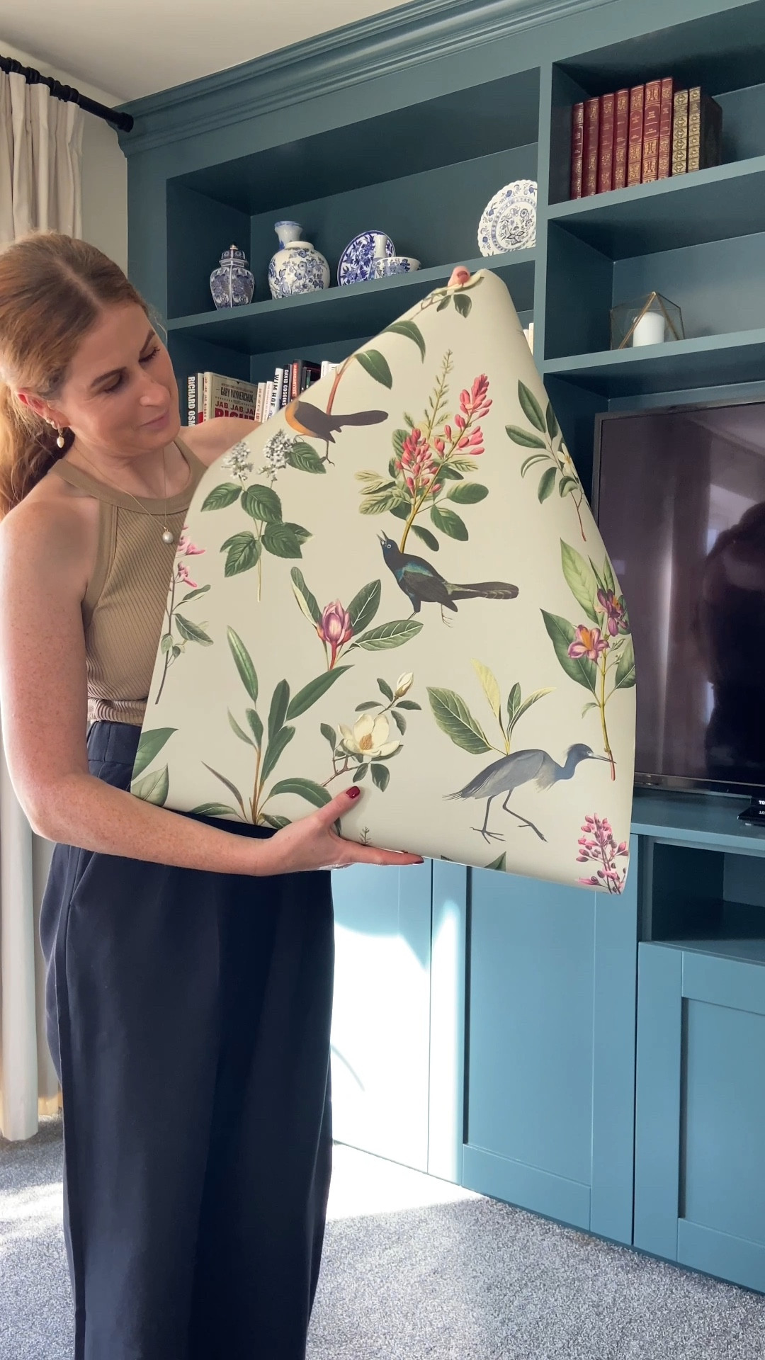 Who knew a single roll of wallpaper could transform a space? I lined the shelves inside our media unit cupboards with it, and it instantly added charm and character. Such an easy DIY hack to protect shelves while adding hidden beauty. Stylish, practical, and so satisfying! ✨🥰 

#LTKHome #LTKOver40