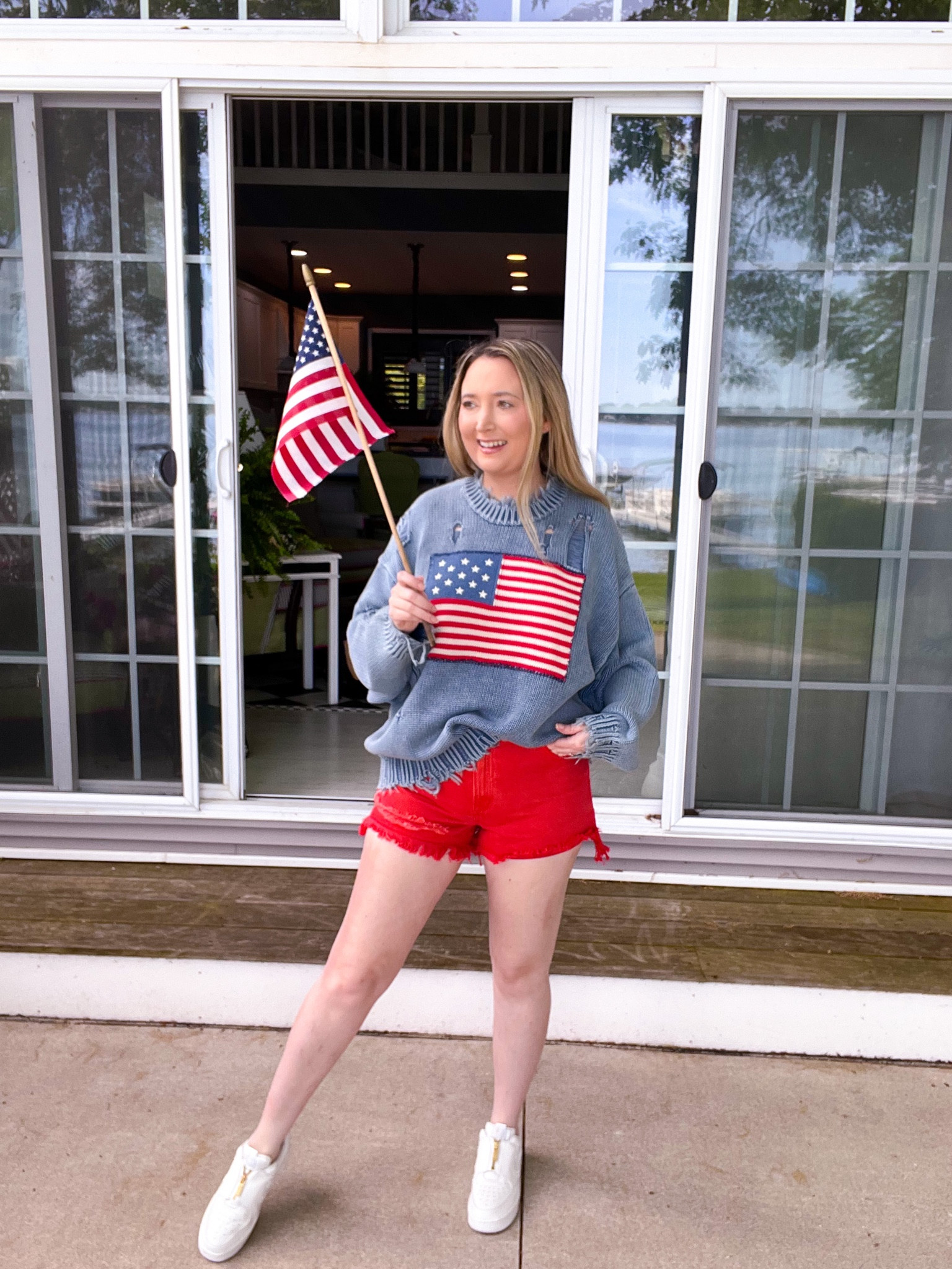 Memorial Day outfit. Flag sweater. American flag sweater. Red shorts. White sneakers. Americana. Rollas. Revolve. Denimist. Fourth of July outfit. 4th of July outfit. Summer outfit.

#LTKSeasonal