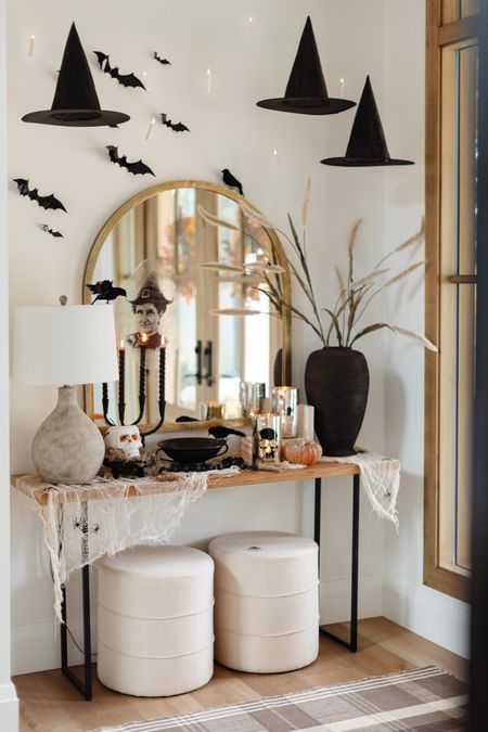 A Halloween entry (from last year) to inspire! 

Spooky, moody, Halloween, bats, holiday, ottoman, entry table, mirror, arched, lamp, vase

#LTKunder100 #LTKhome #LTKSeasonal