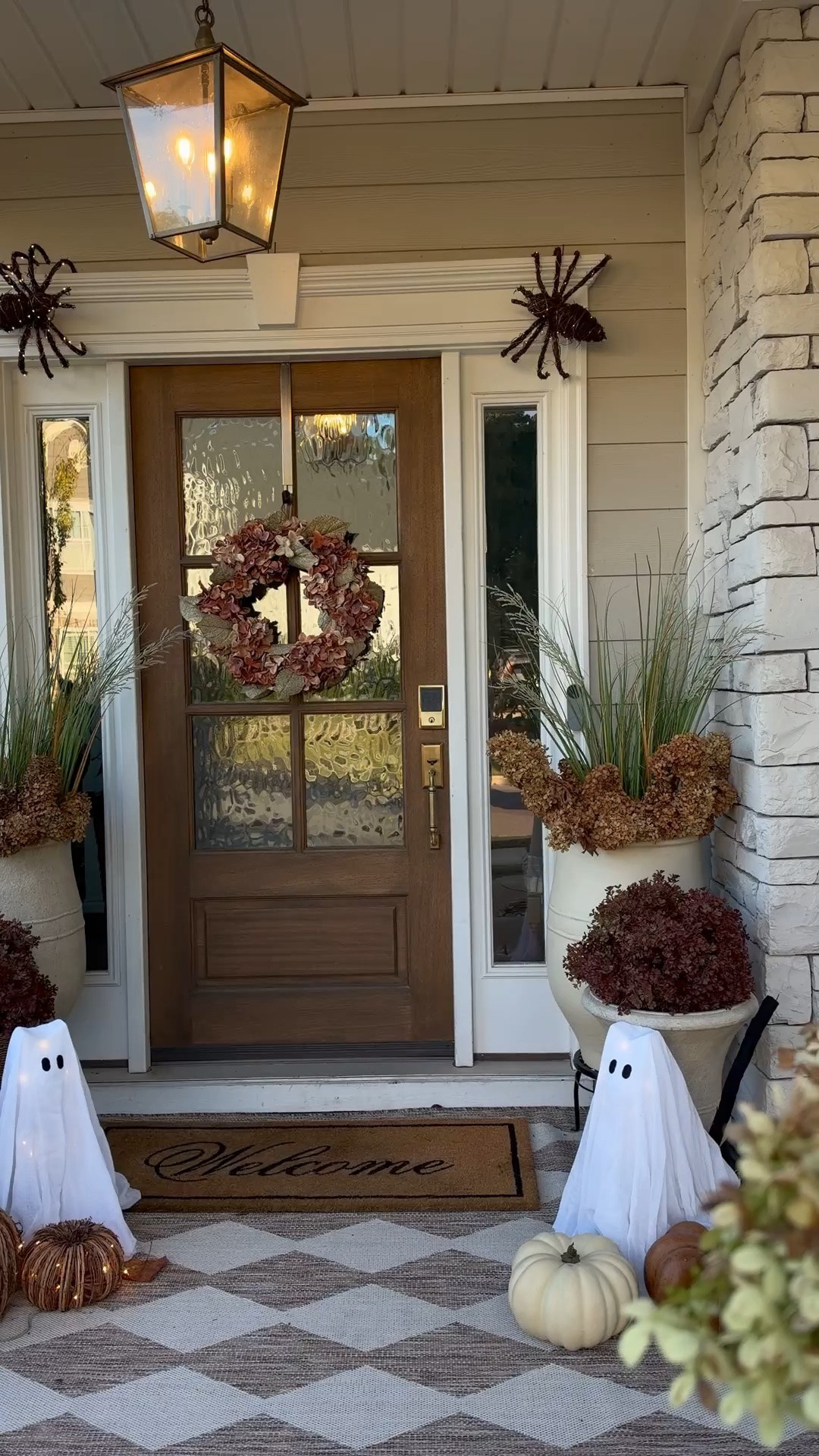 Halloween front porch but make it pretty 
Ghost cats, lit spiders, pumpkins on sale, outdoor rug, porch planters, fall outdoor florals