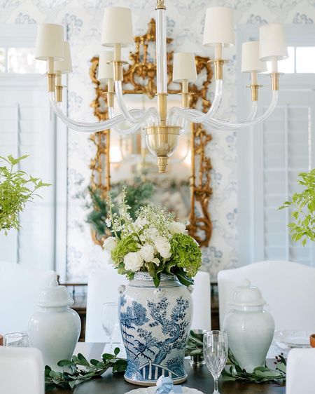 Christmas table blue and white decor grandmillennial style tablescape chinoiserie vase floral centerpiece garland magnolia leaf garland pine tree blue white nutcracker ginger jar dining chairs slip covered glass crystal chandelier holiday Christmas 

#LTKSeasonal #LTKHoliday #LTKhome