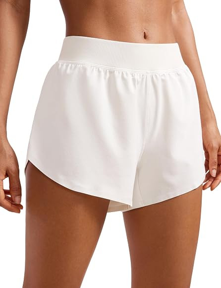 CRZ YOGA Mid Waisted Dolphin Athletic Shorts for Women 4" Lightweight High Split for Gym Workout ... | Amazon (US)