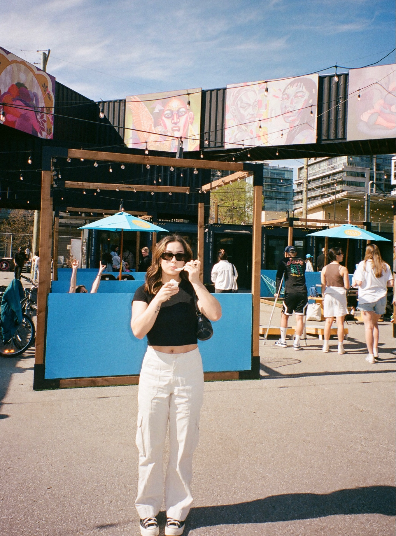 Sunny spring day at Stackt Market in Toronto. Wearing beige Abercrombie Curve Love cargo pants, a black Aritzia T-shirt, black Oak and Fort sunglasses, and black converse. 

#LTKfit #LTKstyletip #LTKunder100