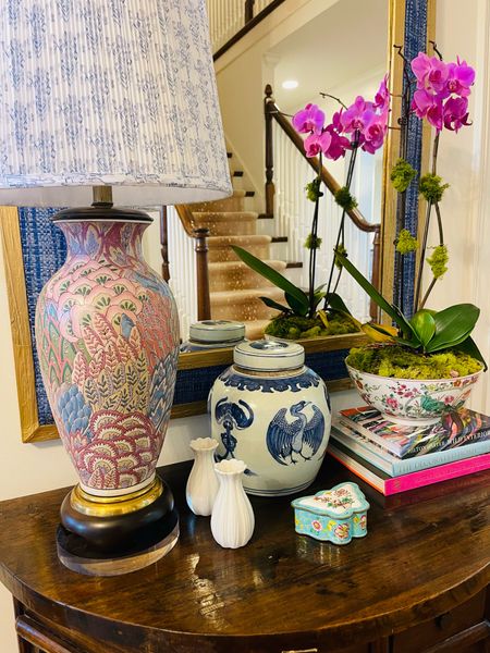 Table top. White bud vase. Pleated lamp shade. Mixing old and new. 

#LTKHome #LTKStyleTip