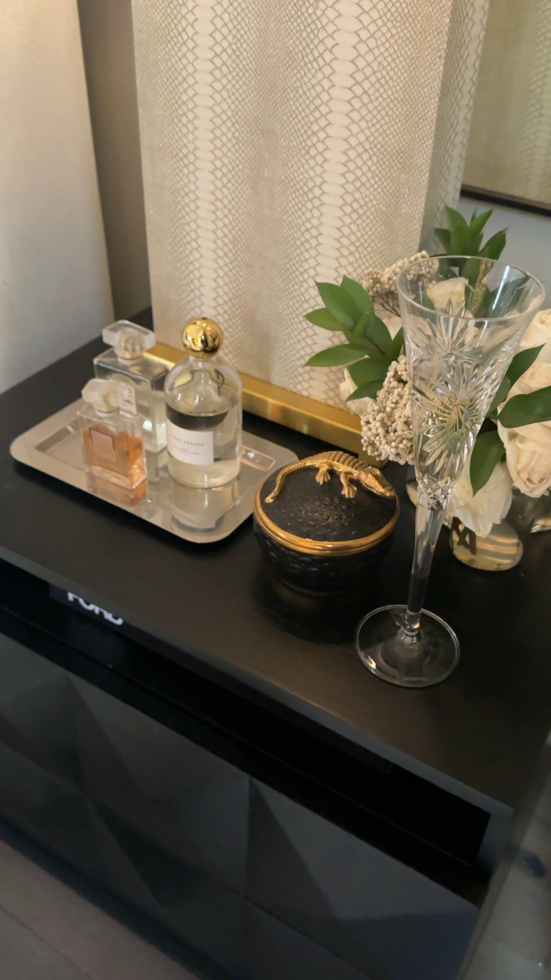 I (Jack) asked Valentina if I could share of my favorite things from around the house. I have to start with her bedside table. I love how she keeps her perfumes corralled on a silver tray. She’s been spritzing this same perfume for years. She always “it just smells so good.” I love the remnant of champagne in her favorite Waterford flute. She loves the ritual of getting ready for bed and truly makes it magical.

#LTKHome #LTKselfcare #LTKmomlife