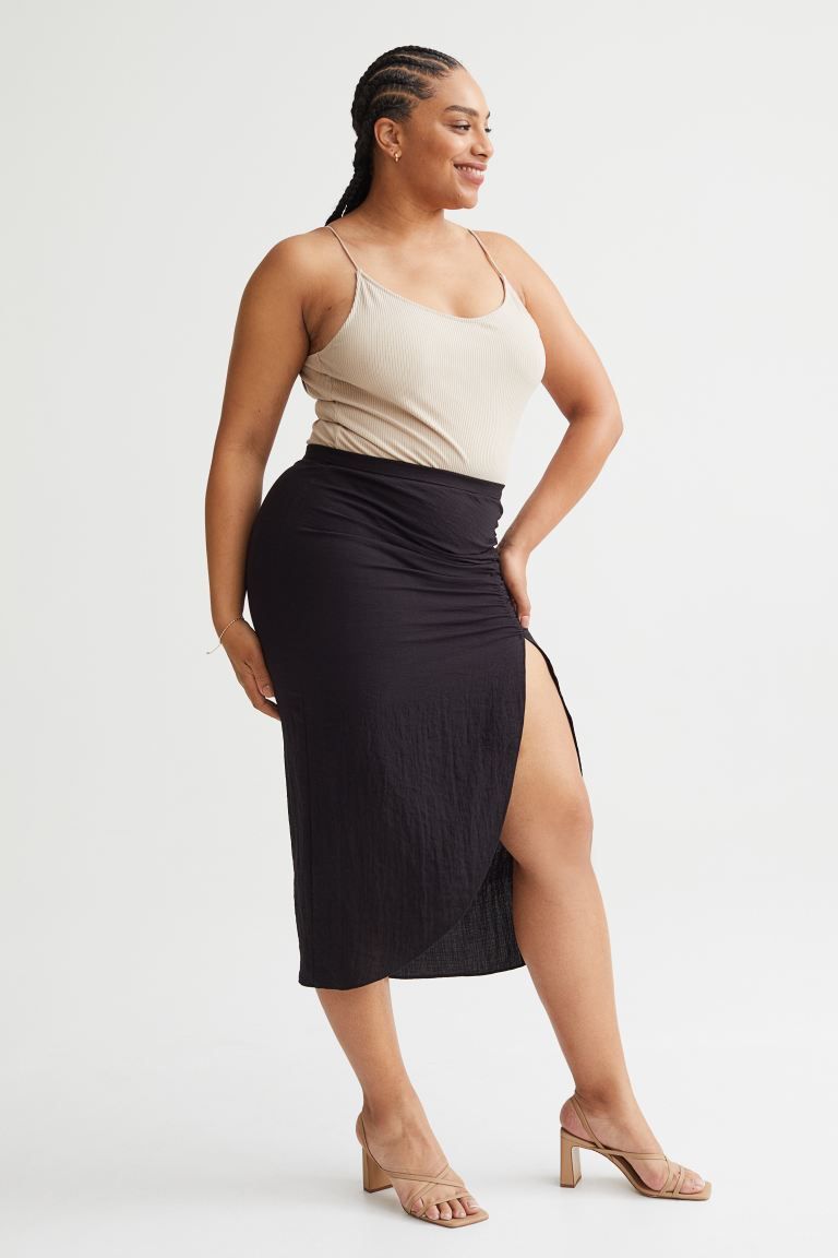 Conscious choiceCalf-length skirt in woven fabric with a high waist and a concealed zip with a ho... | H&M (UK, MY, IN, SG, PH, TW, HK)