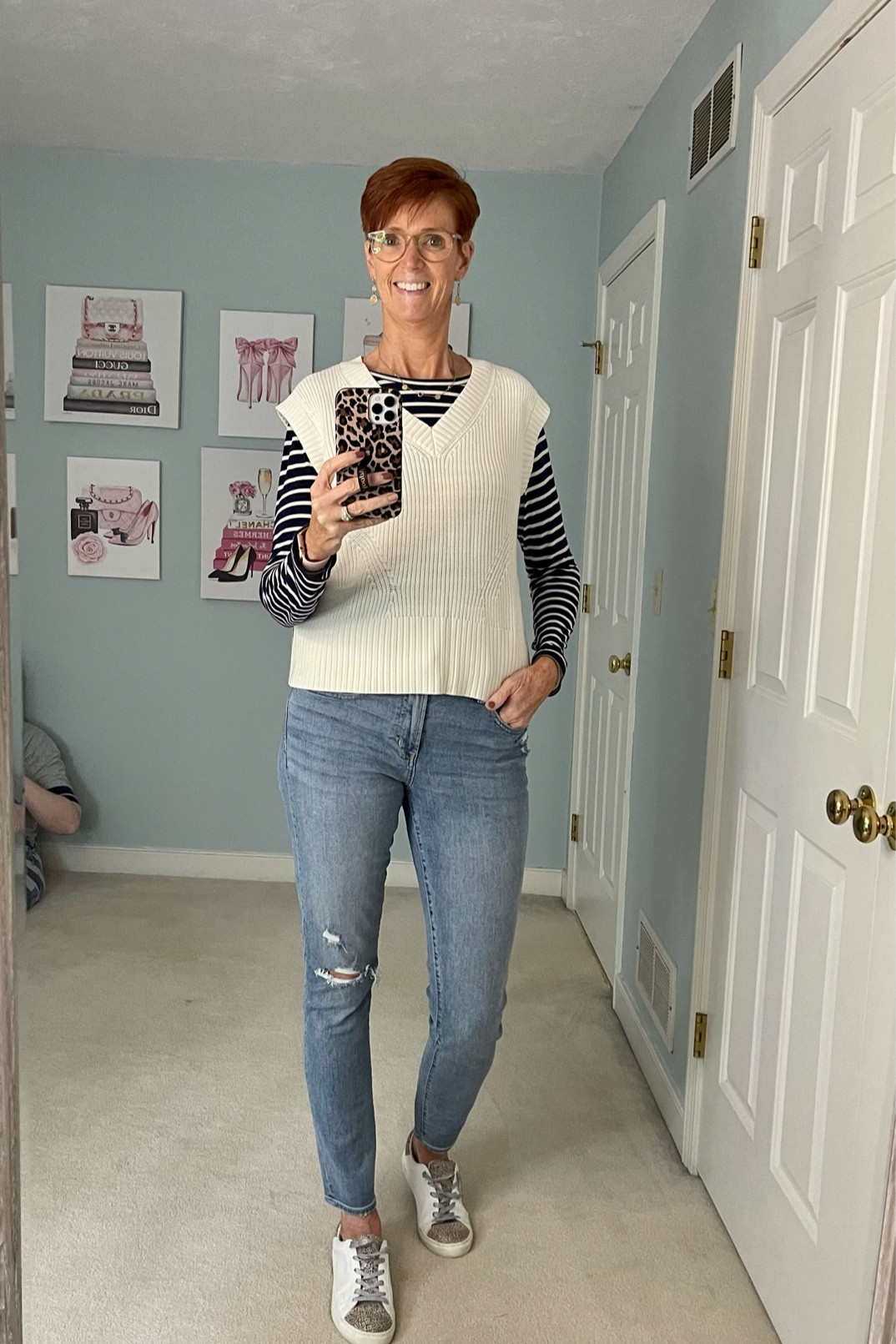 Stripes and distressed jeans with a vest. 

Fall outfit, striped shirt, sweater vest, distressed jeans, classic outfit

#LTKstyletip