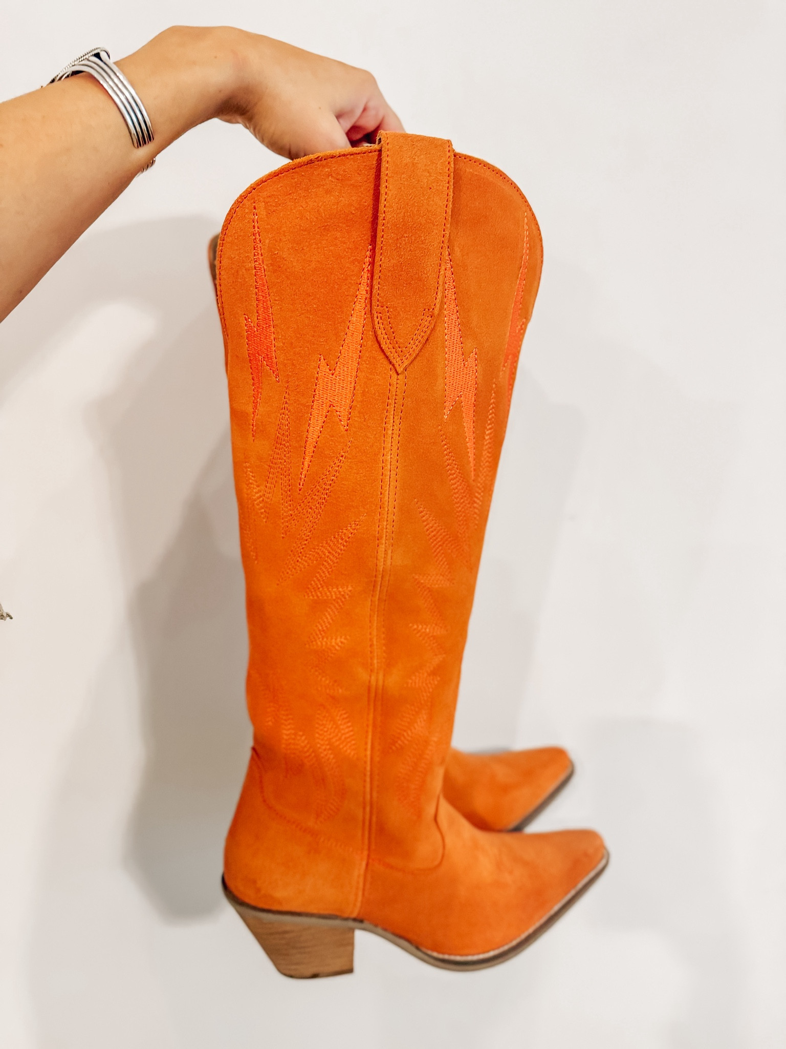 Orange thunderbird suede cowgirl boots - country concert outfit idea Nashville or music festival - cowboy boots - dingo viral boots 

#LTKTravel #LTKStyleTip #LTKShoeCrush