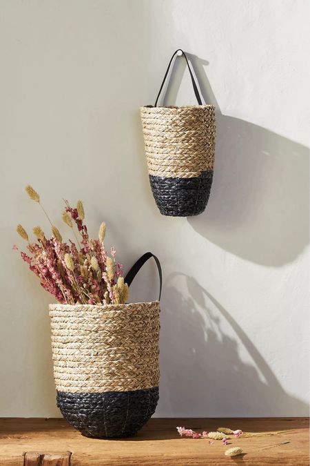 Transform your mudroom or entryway with charming hanging baskets! These versatile baskets provide a delightful spot to showcase decorative flowers or conveniently store light accessories like scarves and gloves. Crafted from a blend of seagrass, plastic raffia, and faux leather, they bring a touch of natural elegance to any space. Elevate your home's organization and style with these perfect additions!

#LTKHome #LTKSummerSales #LTKSaleAlert