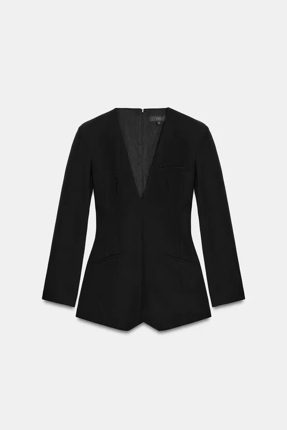 Short V-neck playsuit featuring long sleeves with shoulder pads. False welt pockets at the front.... | Zara UK
