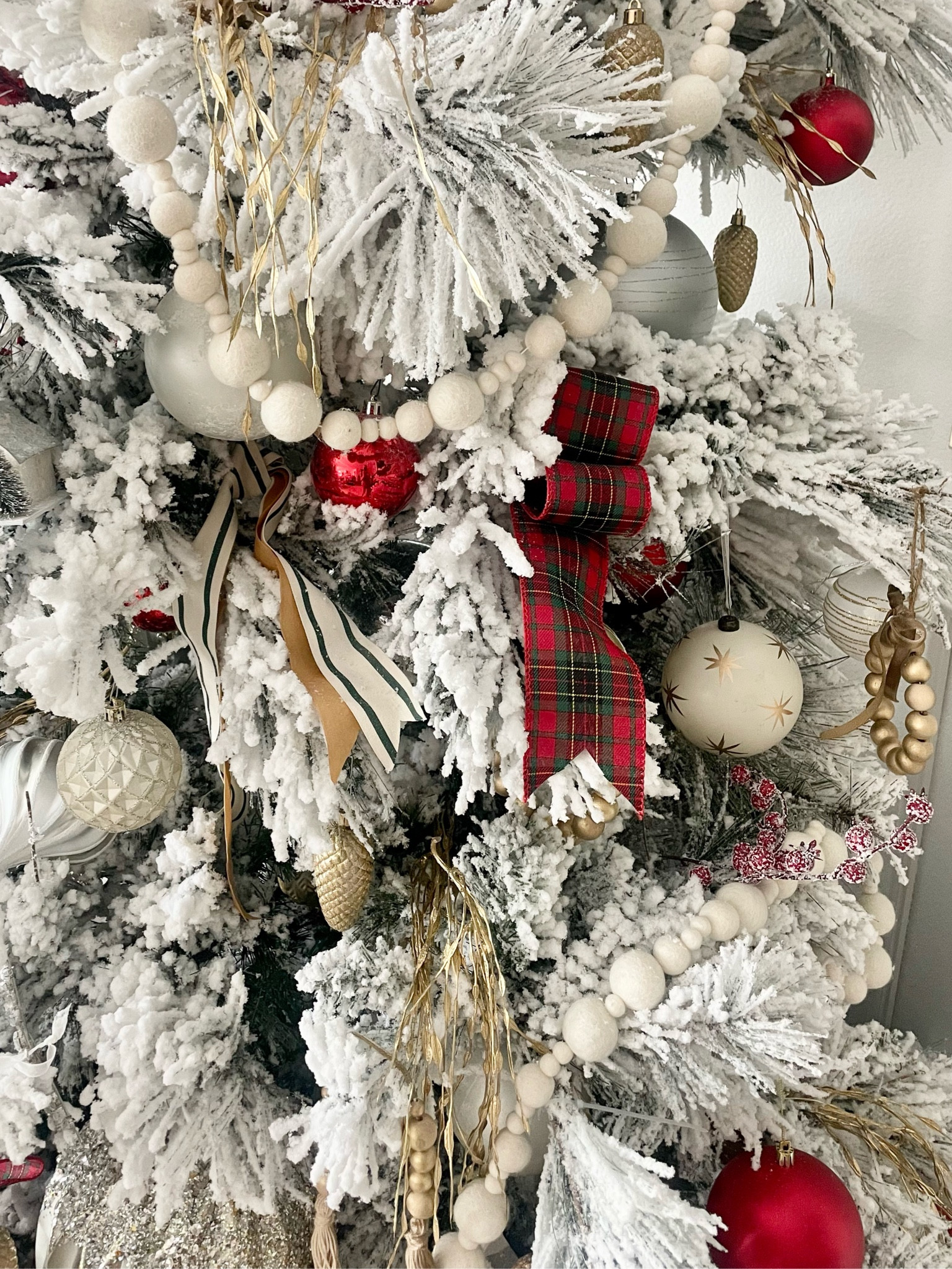 Close up of our Christmas tree details 

Ornaments
Garland
Flocked tree
Christmas decor
Christmas decorating 
Ribbon
Faux tree 
Plaid ribbon 

#LTKHoliday #LTKhome #LTKSeasonal