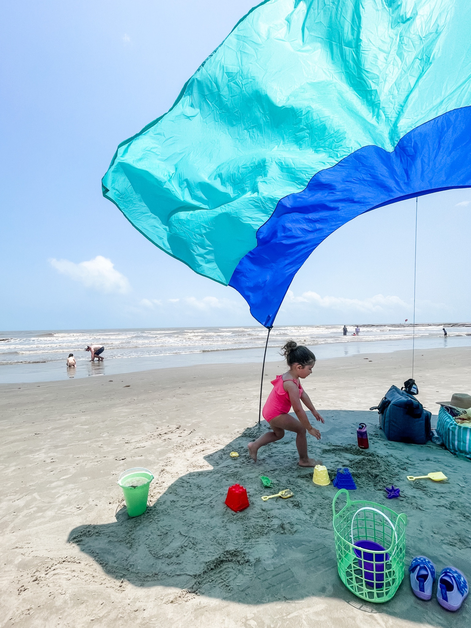 Favorite beach purchase! This thing was amazing & so many people came up and asked about to. Easy setup and take down too! Beach canopy, beach shade, wind powered beach shade, beach tent. 

#LTKSeasonal #LTKtravel #LTKFind