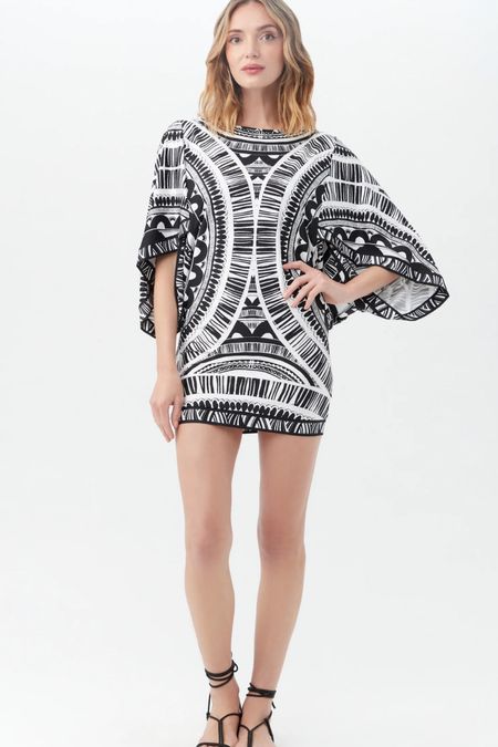Trina Turk
HULA CASABLANCA TUNIC

Pack this versatile swim cover-up dress on your next vacation and go from the beach to dinner in a snap. Made in lightweight swim jersey, this swim cover-up tunic dress can be worn over a swimsuit, styled as a top paired with your favorite shorts, or worn on its own as a stylish minidress.

#LTKStyleTip #LTKTravel #LTKSwim