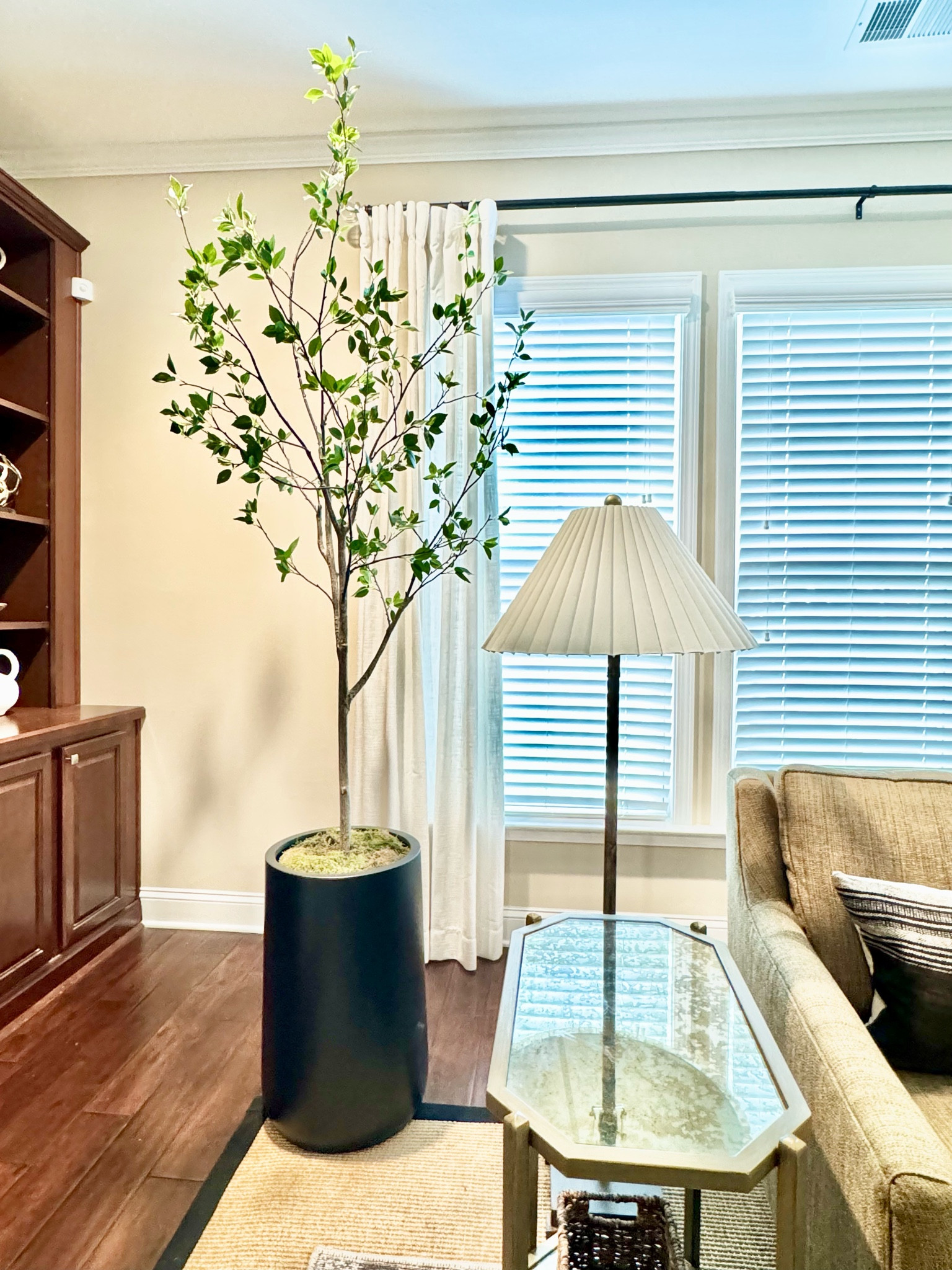 This faux citrus tree is so realistically natural! Raising it inside this tall planter adds even more height and drama to this corner.

#LTKHome