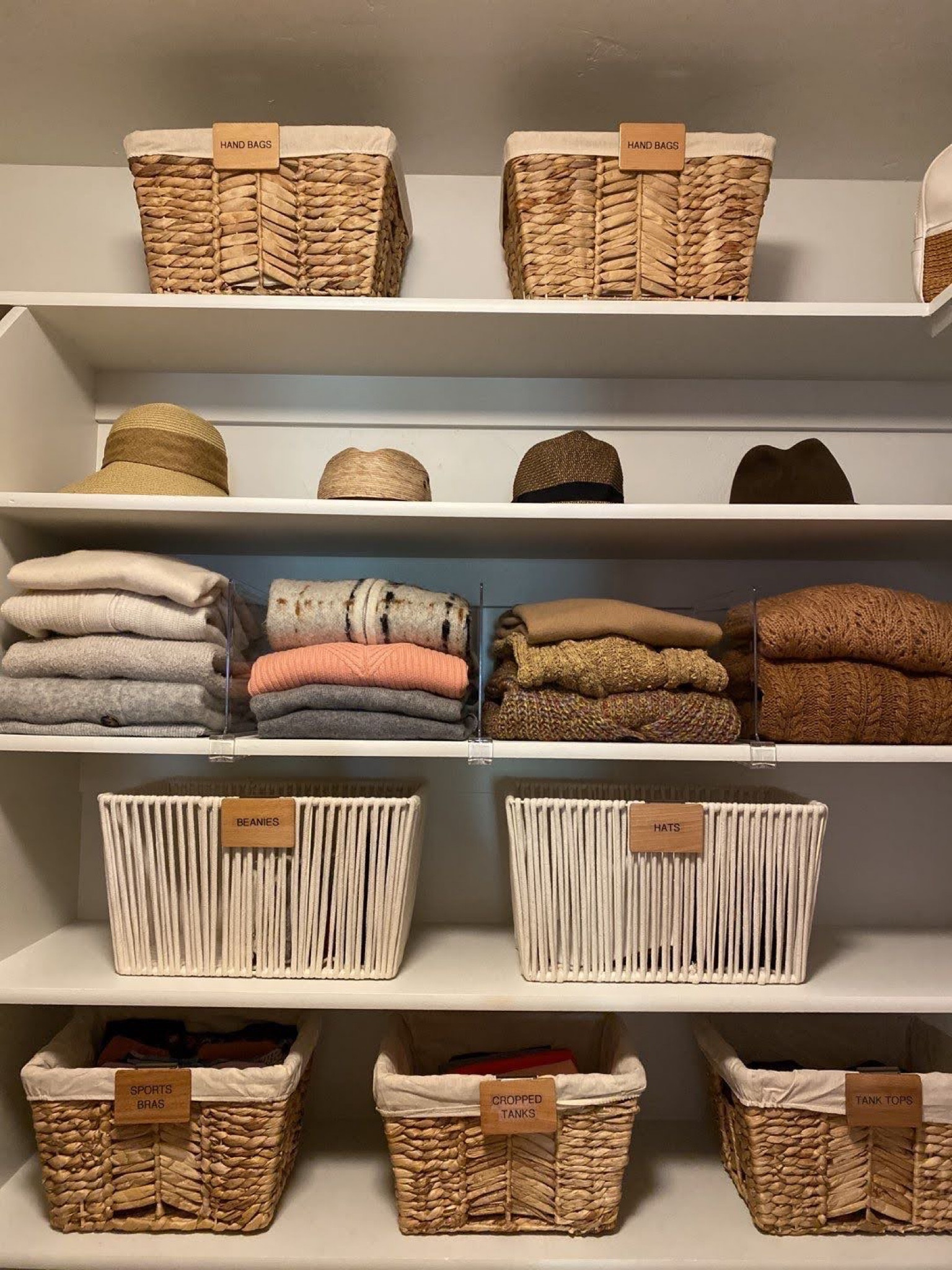 We love to fold sweaters on shelves, then divide them with shelf dividers. Other small categories go in baskets! 

#home #closet #closetinspo #organize #clothes 

#LTKhome