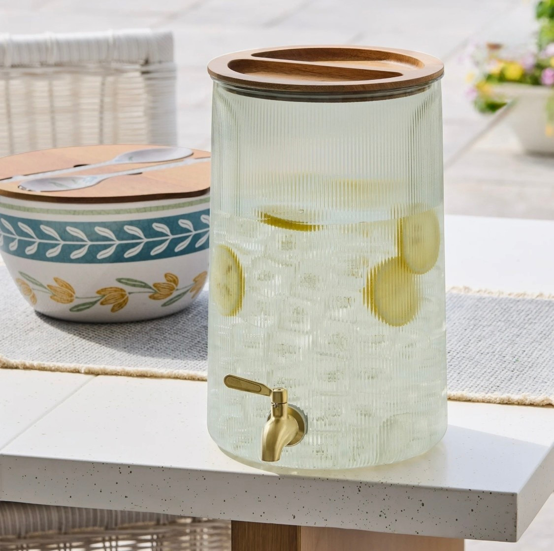 Add a touch of timeless charm with Better Homes and Gardens 2-Gallon Green Countertop Beverage Dispenser with Acacia Wood Lid. Featuring durable materials such as body-100% acrylonitrile styrene copolymer, lid-100%acacia wood, spigot-100%stainless steel, this piece is thoughtfully designed to complement modern and classic spaces alike. A beautiful addition to both daily routines and hosting moments