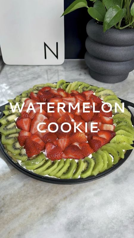 🍉Comment Shop and I'll send you a DM with the supplies I used.  Bringing summer vibes to your dessert table with this adorable Watermelon Cookie Cake! 🍉 🍪  Made with layers of soft, chewy cookie goodtness, topped with fluffy whipped cream, and fresh strawberries and kiwi slices. You could also add chocolate chips to mimic the look of seeds. This treat is sure to be a hit at your next gathering. 🍓🥝 Serve up a slice and watch as smiles grow as big as slices of juicy watermelon. Get ready to indulge in a taste of summer with every bite! ☀️🍉 Watermelon | Party Ideas | Party Food | Birthday Cake | Birthday Ideas | Cookie Cake | Summer Treats | Watermelon Cake | Easy Recipes

#LTKHome #LTKParties #LTKVideo
