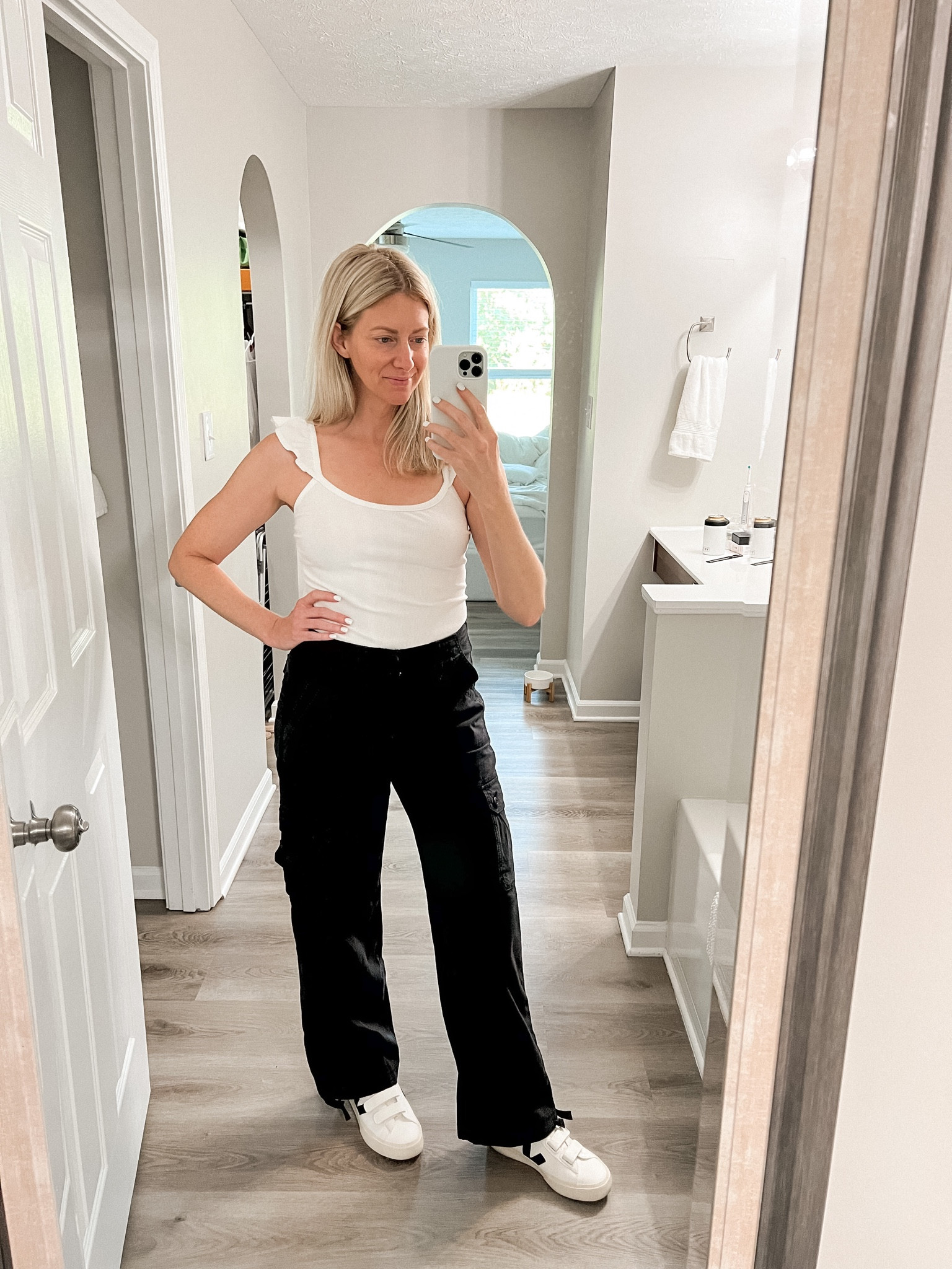 On sale! Black baggy cargo pants that tie at the ankle for a cute jogger look. They have some stretch which makes these so comfy! Wearing size 4. 

#LTKunder50 #LTKshoecrush #LTKsalealert