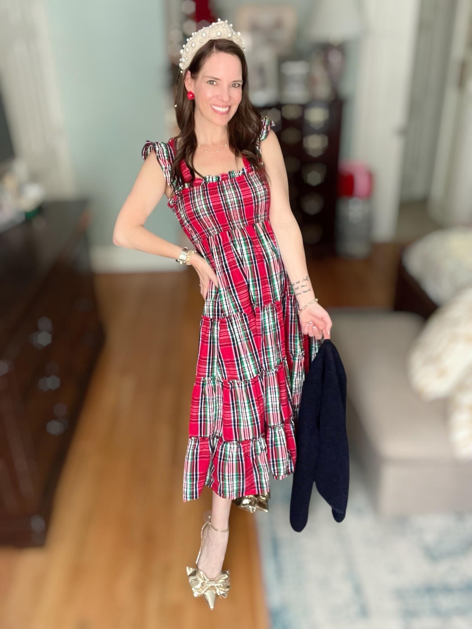Full holiday magic moment 🎄❤️ This plaid smocked dress is so comfortable and flattering — stretchy on top, flowy through the skirt, and perfect for everything from school parties to Christmas Eve service to cookie decorating at home. I layered it with the softest navy cardigan for that cozy classic look and added my favorite pearl headband for a little princess sparkle ✨ The gold bow heels are the show-stoppers — they make every outfit feel special! And the little red flower studs tie the whole festive vibe together without being too much. So sweet, so cheerful, so holiday.

⸻

christmas plaid dress • holiday party outfit • feminine holiday style • classic christmas plaid • navy cardigan outfit • pearl headband • festive accessories • gold bow heels • holiday family photos outfit ideas • winter church outfit • merry and bright 🎄❤️✨

#LTKFindsUnder50 #LTKHoliday #LTKShoeCrush