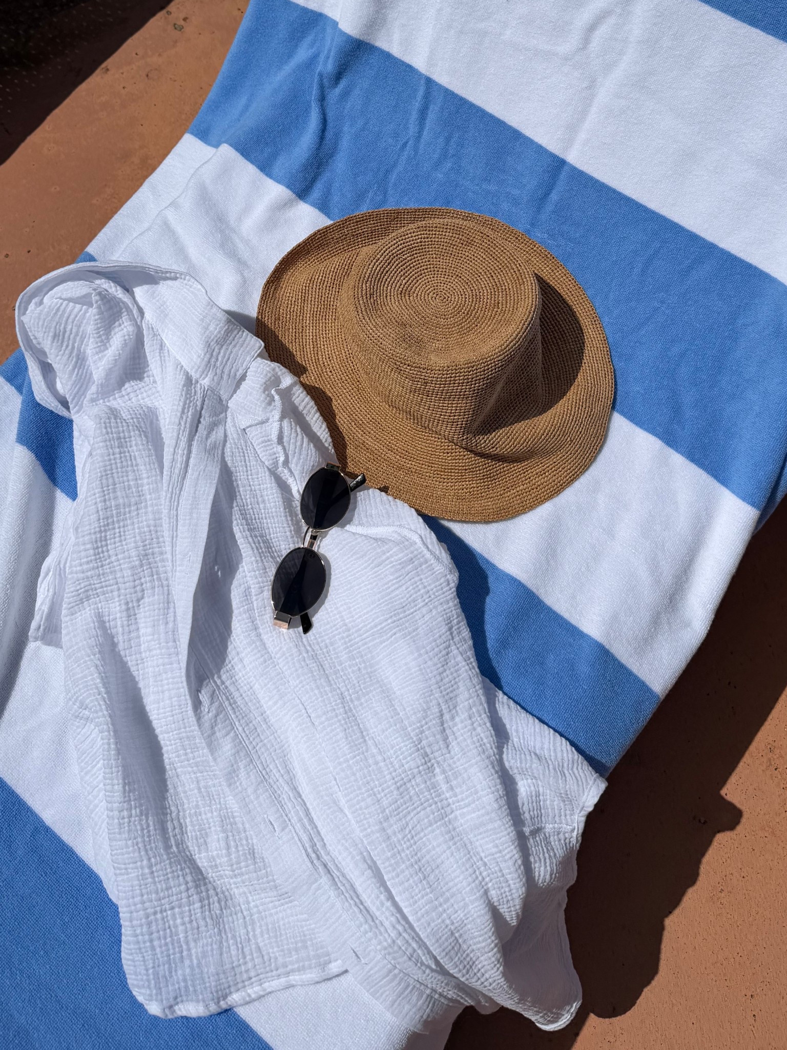 Pool day essentials, Aritzia raffia bucket hat, sun hat, striped beach towel, button down coverup 

#LTKSwim #LTKootd #LTKSeasonal