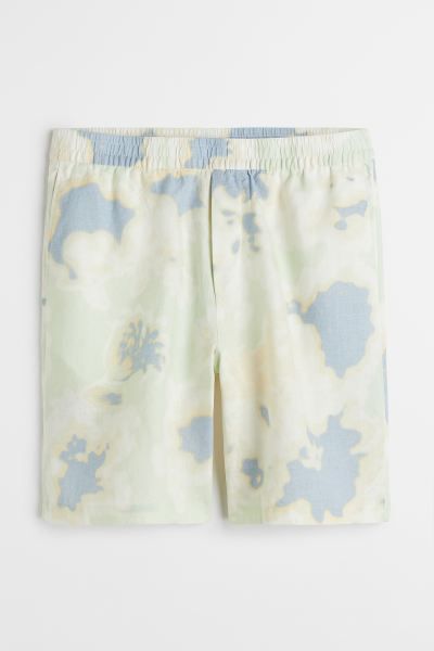 Relaxed-fit, knee-length shorts in airy linen with a printed pattern. Elasticized smocking at wai... | H&M (US + CA)