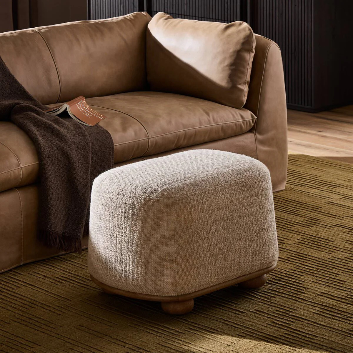 Four Hands Bilbury Oval Ottoman in Saxon Sand | The Addison West