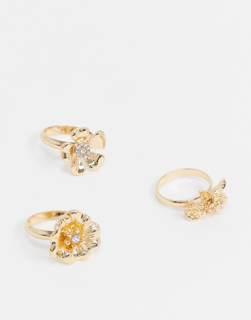 ASOS DESIGN pack of 3 rings with flower design in gold tone | ASOS (Global)