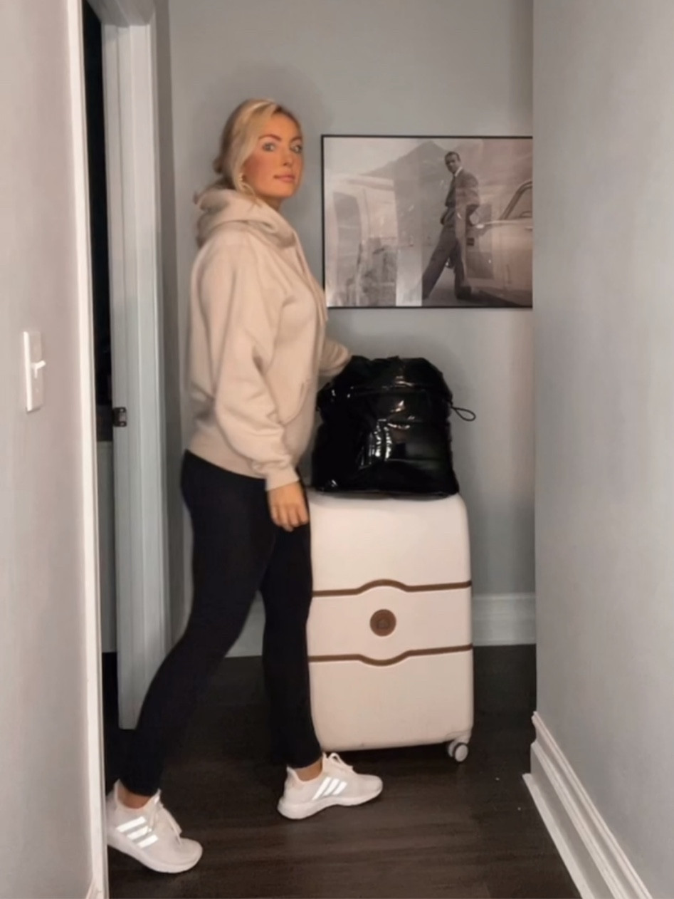 Airport Travel Outfit ✈️🫶🏼 
Happy you’re here babe! xx
#travelootd #beautyproducts #makeup

Delsey Hard Spinner Luggage 28” {Champagne}
Black Patent Puffer Tote Bag
Adidas Sneakers {TTS}
Pretty Little Thing Sand Hoodie Sweater 
Kitsch Gold Hair Clip
Maison Magiela Replica {Fireplace }
Supergoop SPF 40 Primer
Laura Mercier Silk Foundation {Medium Ivory}
NYX Nude Truffle Lipliner 
MAC Crème Cup Lipstick 
Buxom White Russian Gloss
Melinda Maria Gold Hoop Earrings 

#LTKunder100 #LTKtravel #LTKstyletip