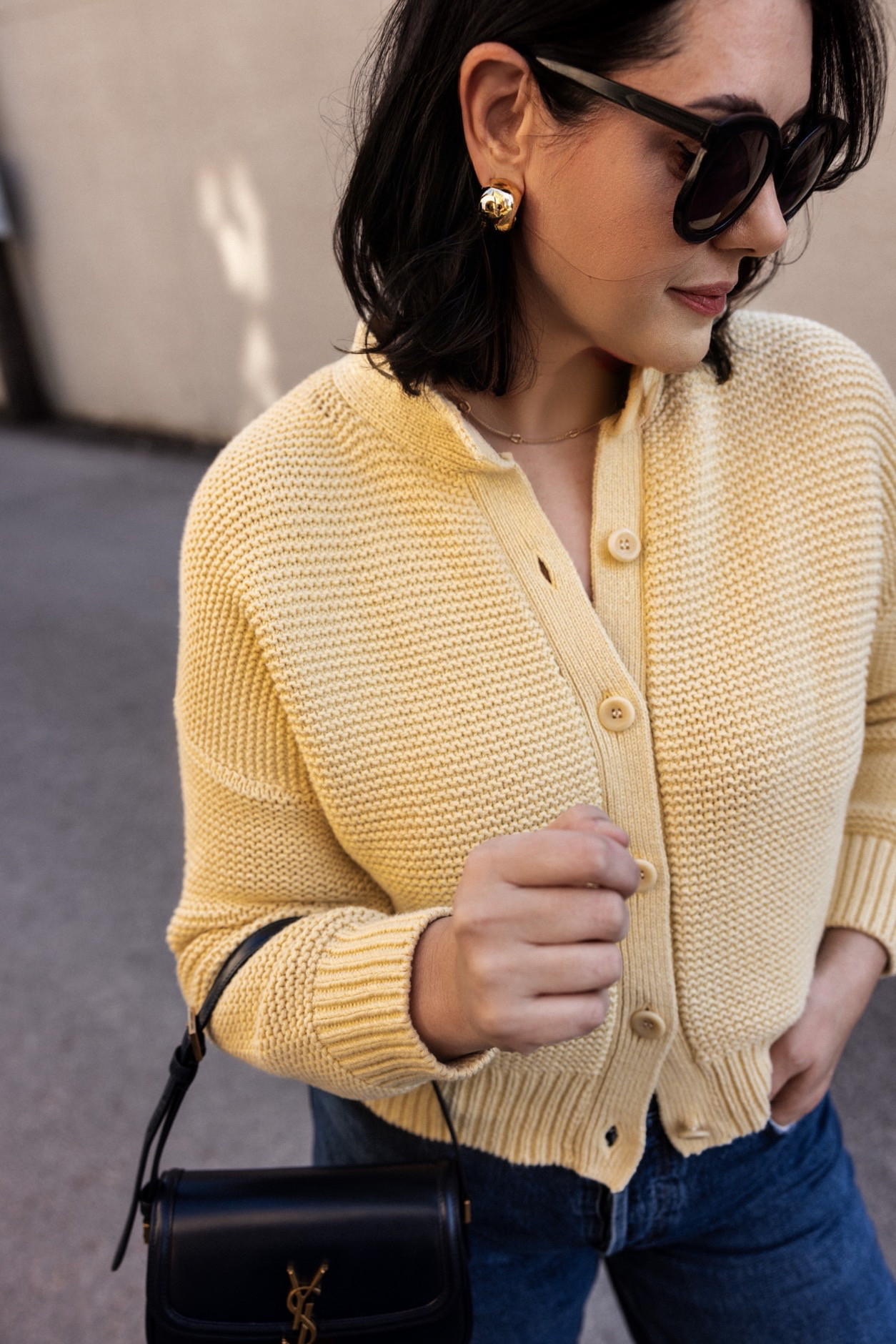 I'm in the large of the Alex Mill cardigan. It runs snug, so I sized up. 

I'm in the 30 of the Agolde, TTS fit. Relaxed overall. 

I've linked many butter yellow sweaters below! 

PS: use code KENDISKEEN for a free month at the luxury subscription service Vivrelle! (That's where my bag is from! I've linked the site here.)  

 