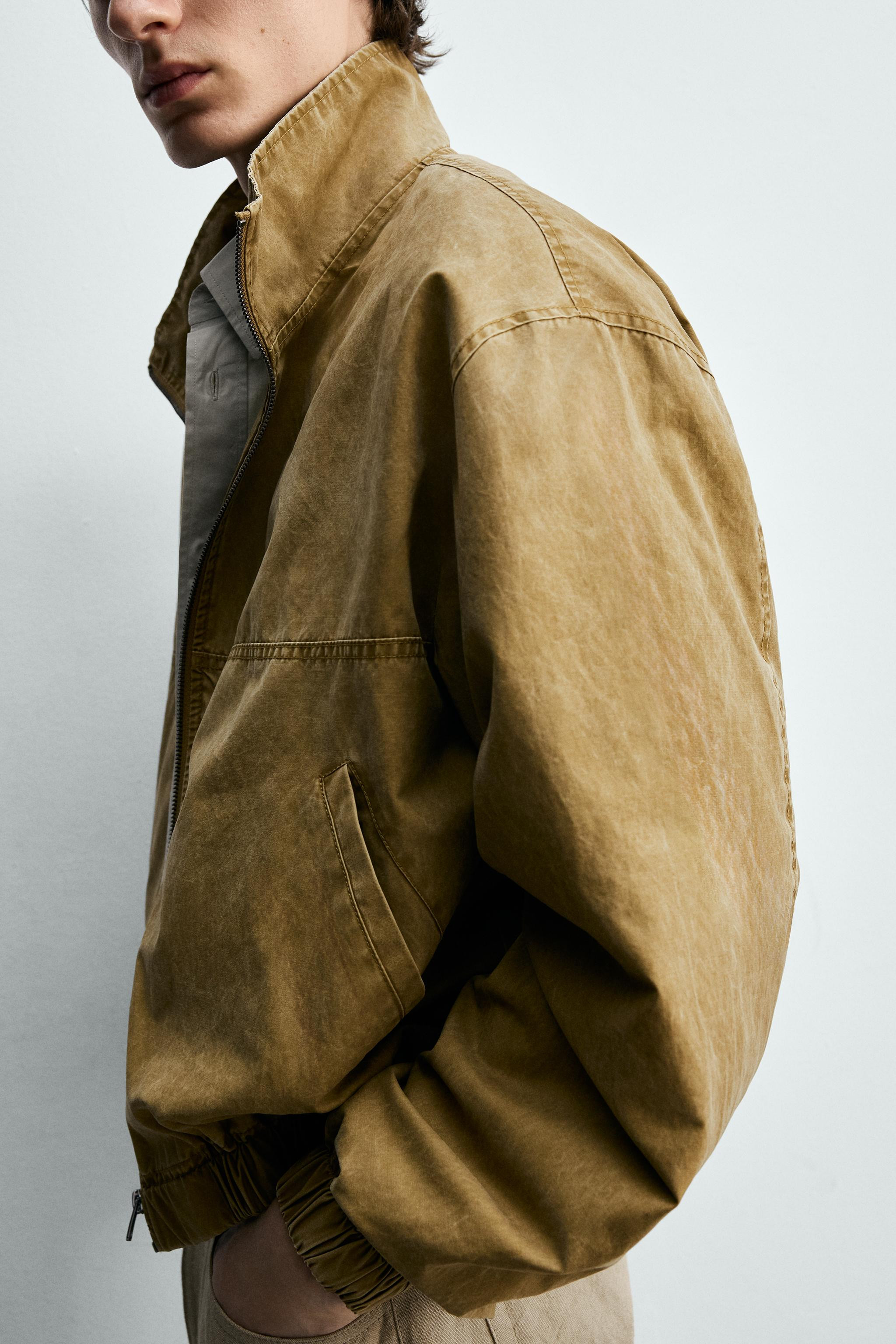 Cropped fit jacket with high collar and long sleeves. Welt pockets at hip and interior pocket. Wa... | Zara US